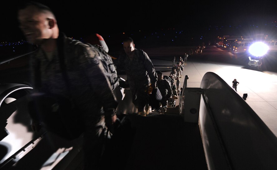 MOODY AIR FORCE BASE, Ga. -- Airmen from the 74th Aircraft Maintenance Unit board a McDonnell Douglas MD-11 for their departure to Bagram Air Base, Afghanistan here Feb. 26. About 300 Airmen from the 74th AMU deployed. (U.S. Air Force photo by Airman Joshua Green) 