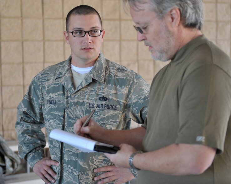 MOODY AIR FORCE BASE, Ga. -- Staff Sgt. Ryan O'Neil, 23rd Aircraft Maintenance Squadron, weapons loader crew team chief, is interviewed by Matt Flumerfelt, a writer with the Valdosta Daily Times, before his deployment Feb. 26 here. Sergeant O'Neil has been a weapons loader primarily for the A-10 weapons system for nine years and this will be his first deployment from Moody. (U.S. Air Force photo by Senior Airman Javier Cruz Jr.)