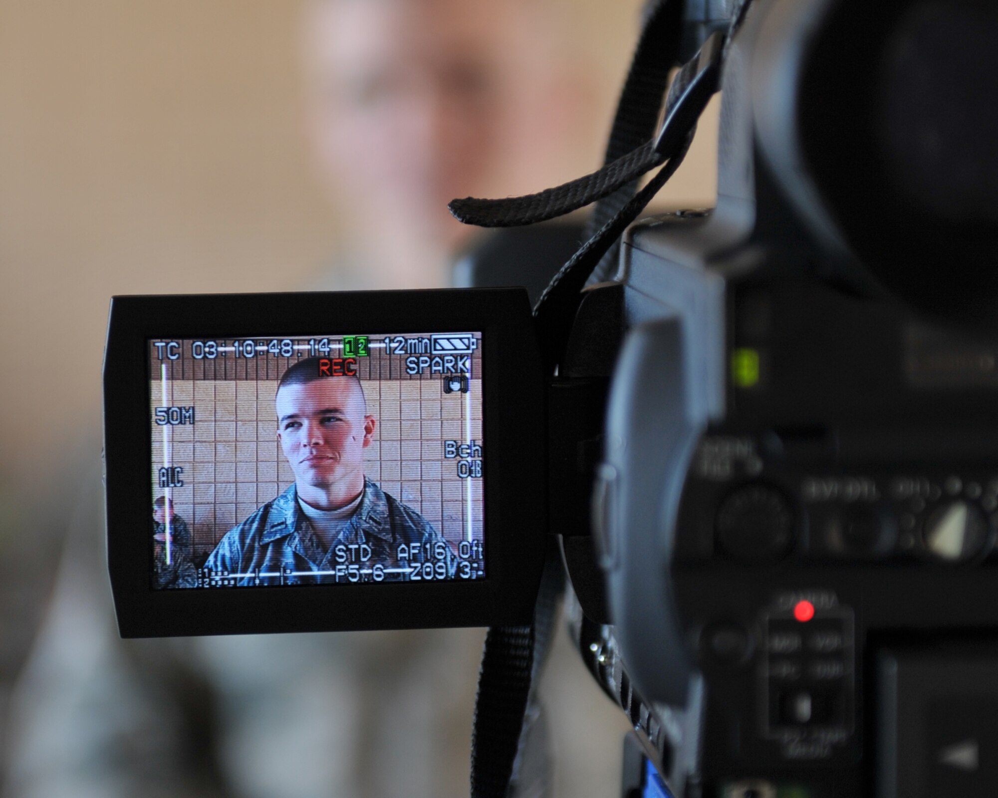 MOODY AIR FORCE BASE, Ga. -- 1st Lt. Charles Merrell, 74th Aircraft Maintenance Unit, assistant officer in charge, speaks with a local news anchor about his thoughts on his upcoming   deployment here Feb. 26. Lieutenant Merrell is one of approximately 300 Moody Airmen who is scheduled to Bagram Air Base, Afghanistan. (U.S. Air Force photo by Senior Airman Javier Cruz Jr.)