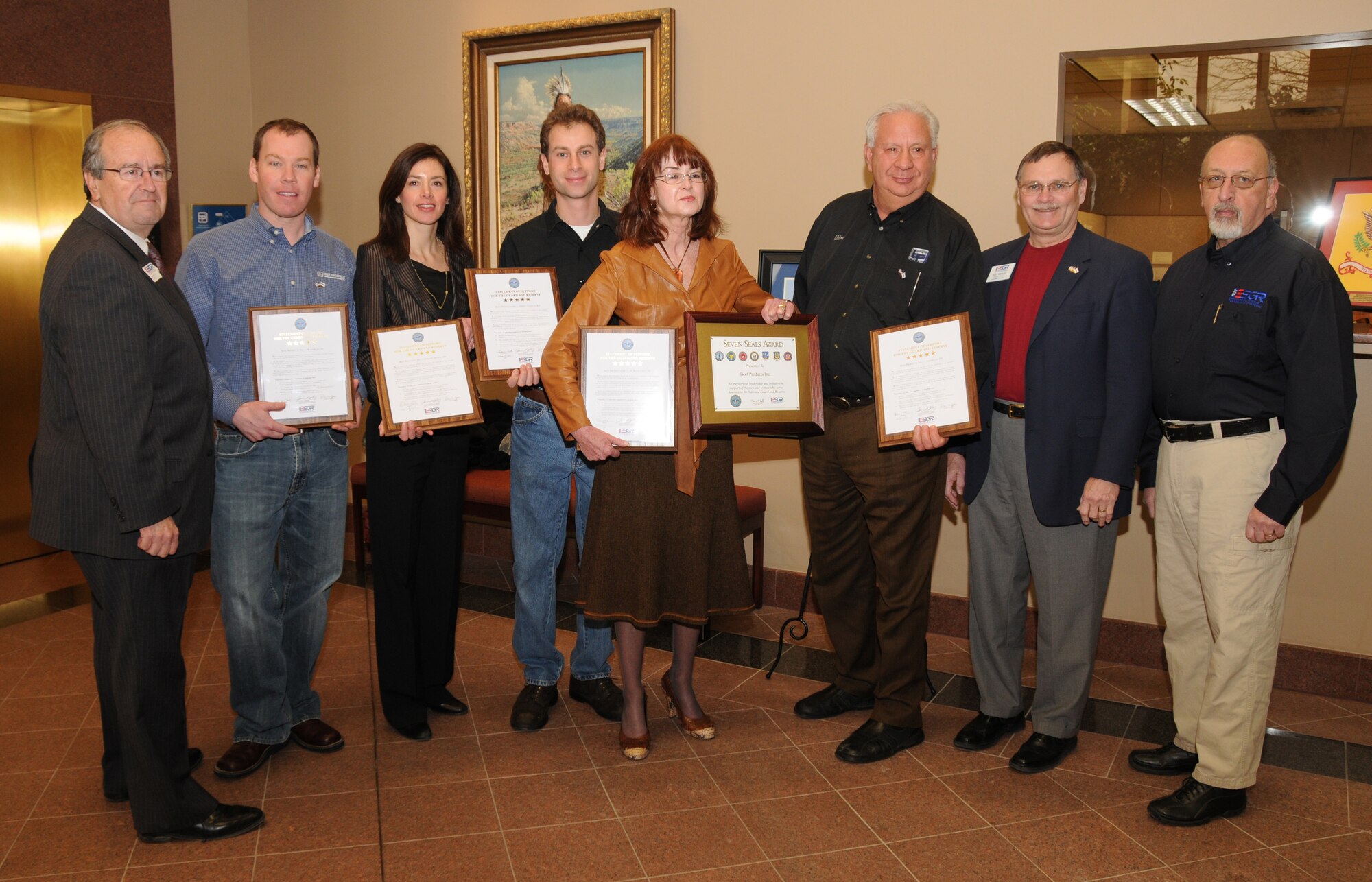 Eldon and Regina Roth (Center) of Beef Products Incorporated (BPI) pose with Craig Letch, Jennifer Roth, Nick Roth and representatives from the Iowa, Nebraska and South Dakota Employer Support of the Guard and Reserve (ESGR). The group is holding five Statements of Support of the National Guard and Reserve from the states where BPI operates facilities. The Roths were also awarded the Seven Seals Award for there meritorious leadership and initiative in support of the National Guard and Reserve. 

USAF Photo by: Vincent De Groot 185th ARW Public Affairs
