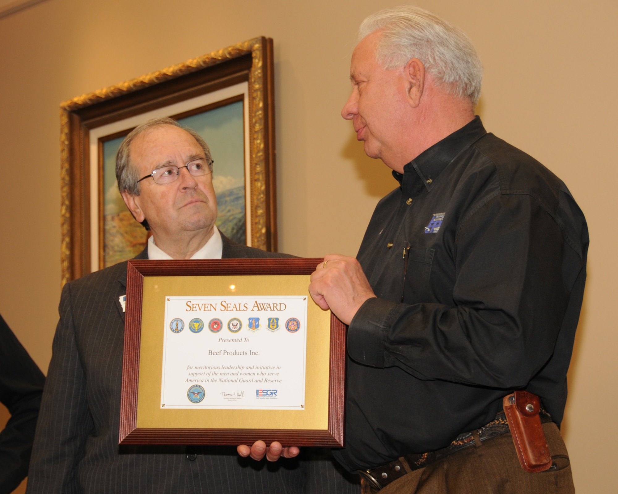 Mr. Barry Spear of the Iowa Employer Support of the National Guard and Reserve awards Beef Products Incorporated founder and CEO with the seven seals award at the BPI headquarters in Dakota Dunes, South Dakota. This award is the highest award given to Employers who go above and beyond in their support for the Guard and Reserve.
USAF Photo by: Vincent De Groot 185th ARW Public Affairs
