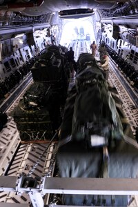 A C-17 Globemaster III aircrew from the 816th Expeditionary Airlift Squadron loads container delivery system bundles onto the aircraft prior to an airdrop mission Feb. 14 in Afghanistan. (U.S. Air Force photo/Staff Sgt. James L. Harper Jr.)
