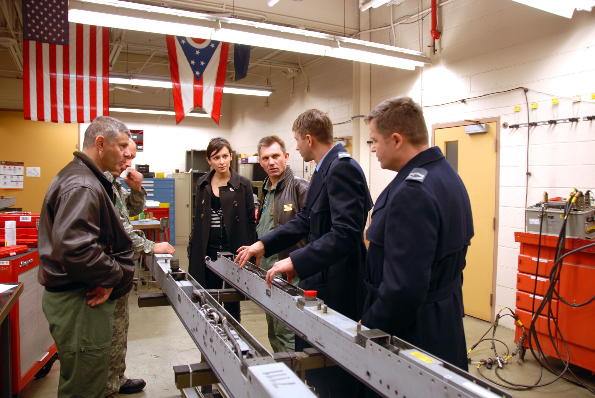 Brig. Gen. Mirko Vranic, Ms. Natasa Mrdak, Senior Master Sgt. Miodrag Markovcevic, and Master Sgt. Sasa Sailovic of the Serbian Air Force receive a briefing on the weapons capabilities of an F-16 Fighting Falcon at the 180th Fighter Wing, Ohio Air National Guard on Jan. 26. Four members of the Serbian Armed Forces General Staff participated in a familiarization visit at the 180th Fighter Wing as part of the Ohio National Guard State Partnership Program.  The primary purpose of the visit was to help them understand how their U.S. Fighter Wing counterparts operate. Ohio began its partnership with the Republic of Serbia in 2006.
