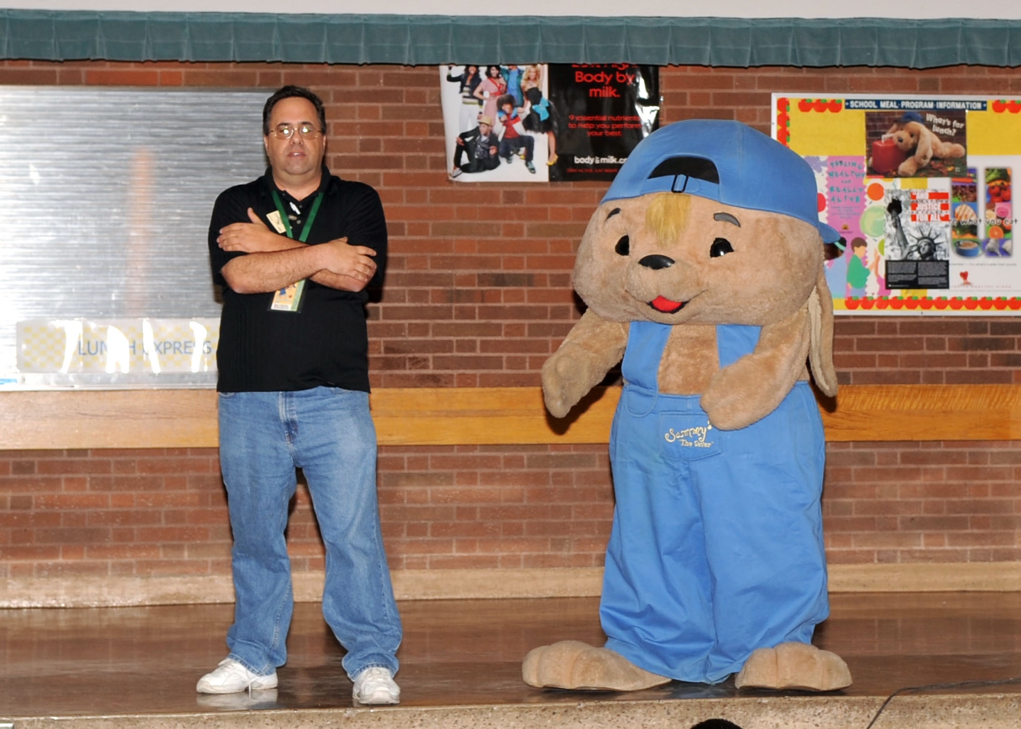 Sammy Rabbit and Sam Renick, children’s author and co-creator of Sammy Rabbit, speak to children at Borman Elementary School during their visit here Feb. 25. Sammy and Mr. Renick also brought their money-saving messages to kids at the D-M Child Development Center. (U.S. Air Force photo/Airman 1st Class Brittany Dowdle)