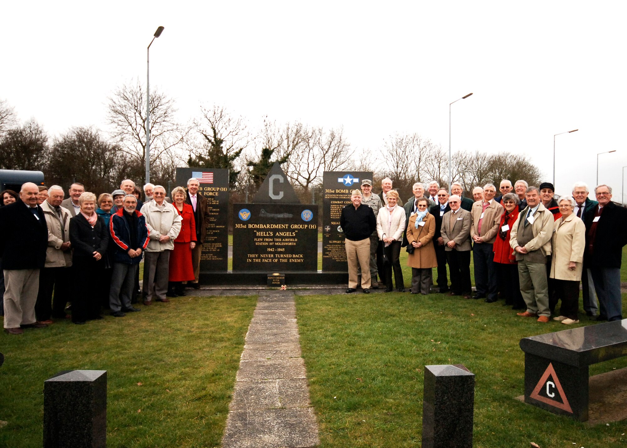 Members of the Nene Valley PROBUS Group of retired business people were welcomed to the 303rd Bomb Group (Heavy) Memorial at RAF Molesworth, England. by Navy Captain Henry J "Harry" Babin, Deputy Commander of the JIOCEUR Analytic Center amd Colonel John J. Jordan, Vice Commander of the 501st Combat Support Wing.  The memorial  honors the 7,336 men who served at RAF Molesworth during Wold War II.  The visit to the memorial was part of an orientation for the group to both RAF Alconbury and RAF Molesworth (U.S. Air Force Photo by Staff Sgt. Rachel A. Goff)