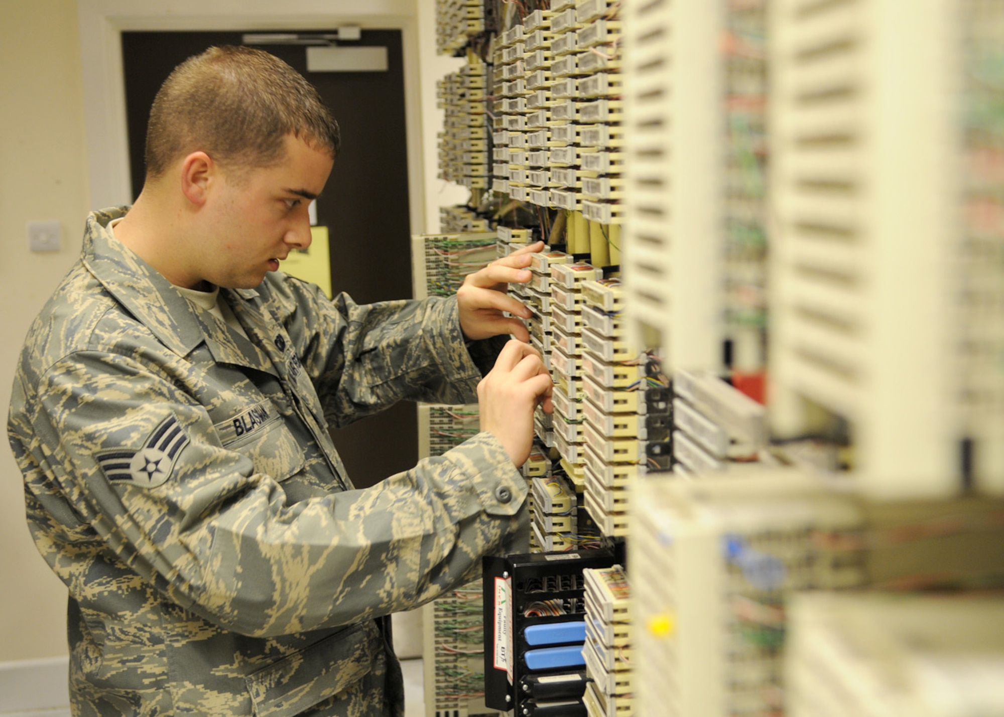 Senior Airman Andrew Blasiman, a 100th Communications Squadron network infrastructure technician journeyman, troubleshoots faulty telephone wiring Feb. 25, 2009, at RAF Mildenhall, England. All telephone landlines on RAF Mildenhall are connected into one central location, enabling Airman Blasiman to quickly troubleshoot and identify the source of the problem and restore telecommunications. (U.S. Air Force photo by Staff Sgt. Jerry Fleshman) 