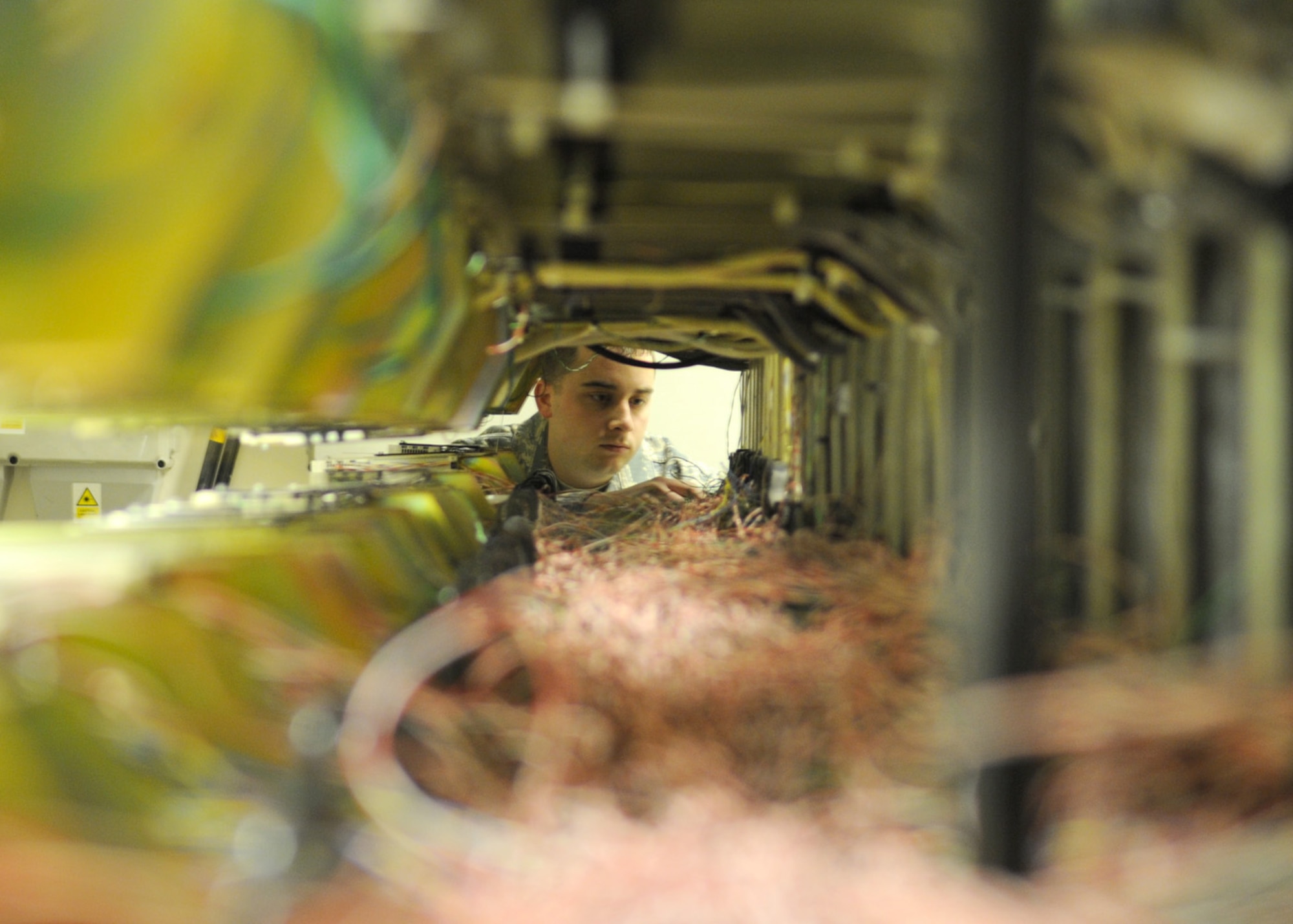 Senior Airman Andrew Blasiman, 100th Communications Squadron network infrastructure technician journeyman, troubleshoots faulty telephone wiring Feb. 25, 2009, at RAF Mildenhall, England. All telephone landlines on RAF Mildenhall are connected into one central location, enabling Airman Blasiman to quickly troubleshoot and identify the source of the problem and restore telecommunications. (U.S. Air Force photo by Staff Sgt. Jerry Fleshman)