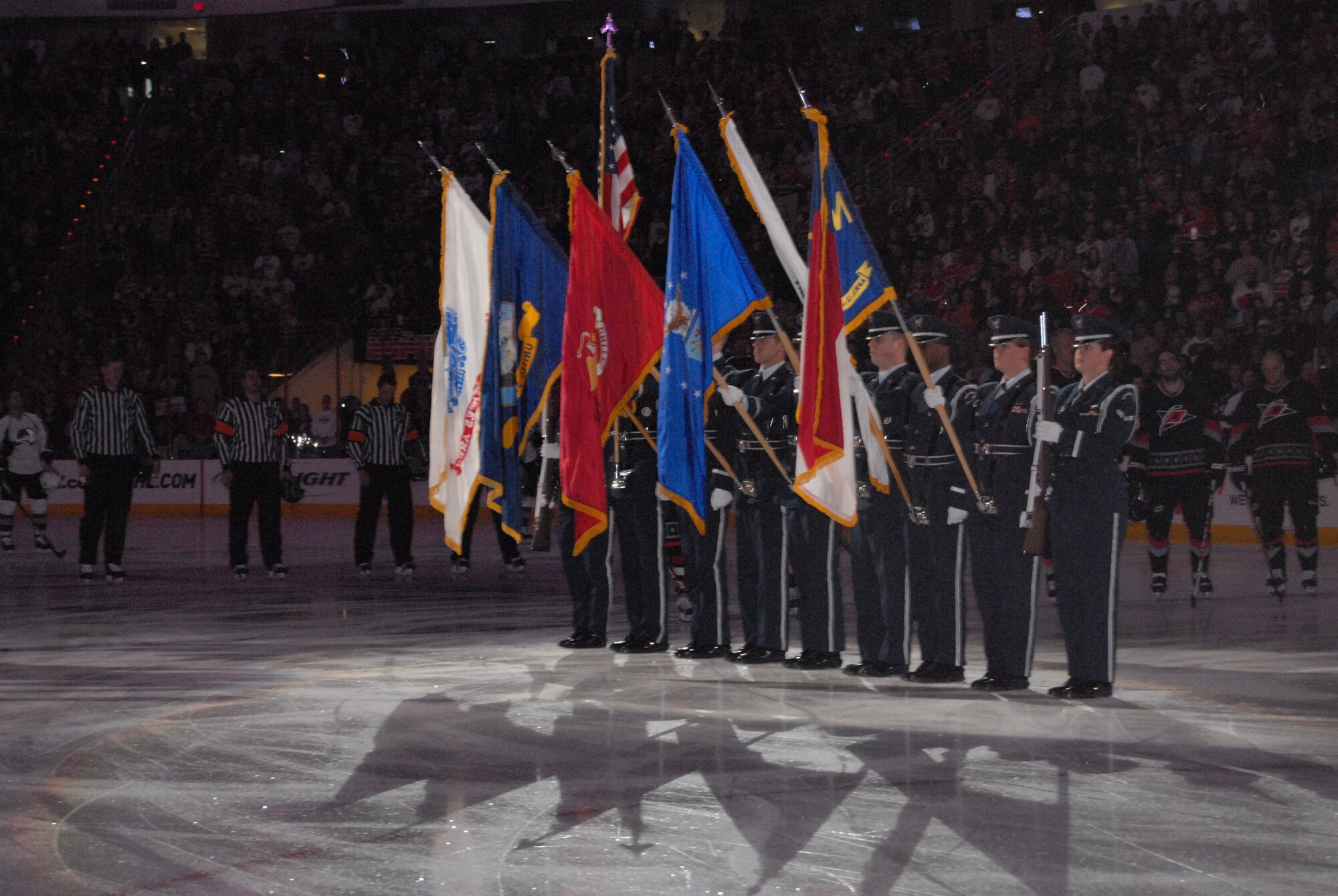 The Pope Air Force Base Honor Guard presents the colors prior to the Carolina Hurricanes Military Appreciation Game VS the Colorado Avalanche, Feb. 22, 2009 at the RBC Center in Raleigh, N.C. (U.S Air Force Photo by Tech. Sgt. Todd Wivell)