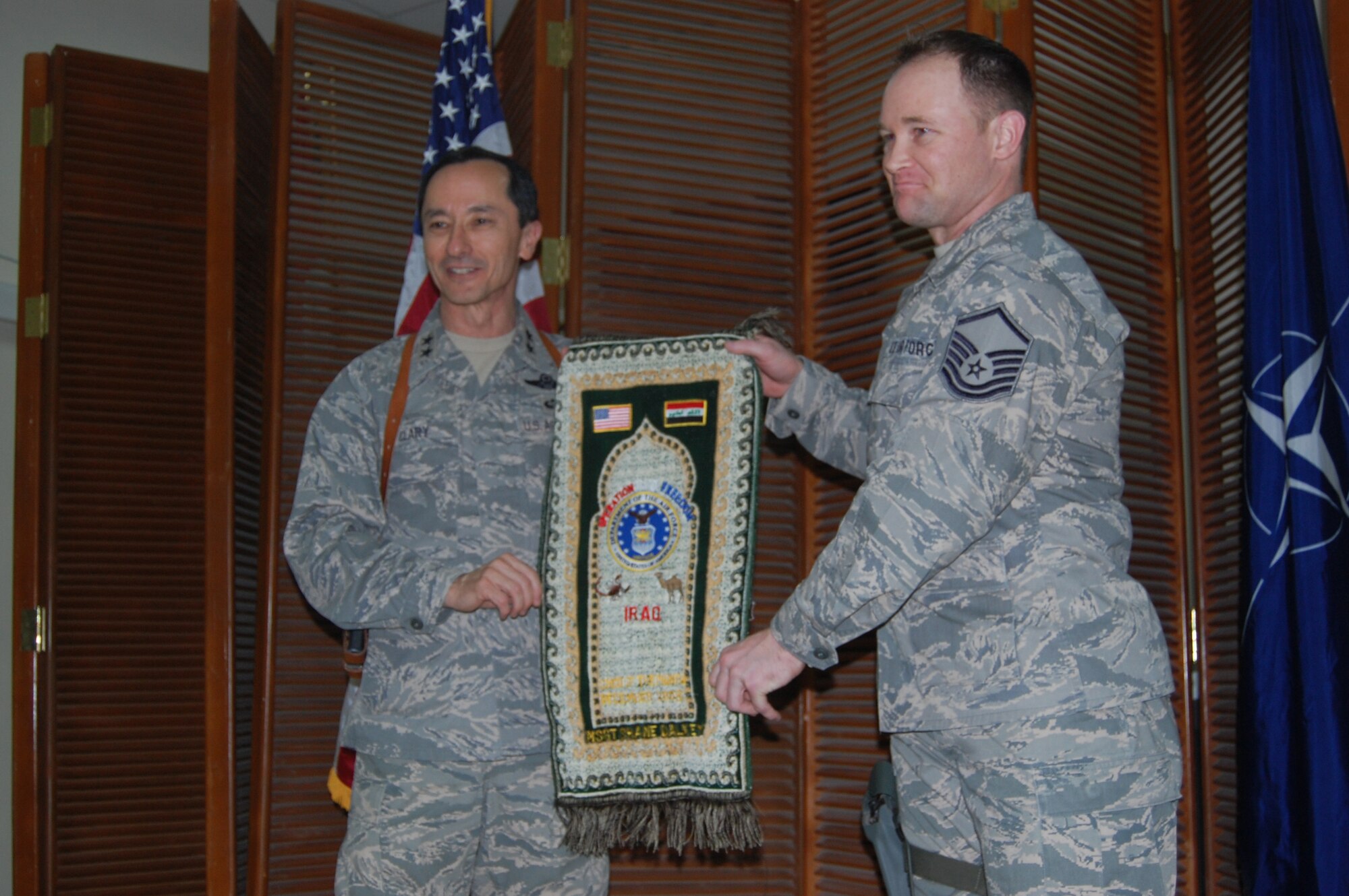 SOUTHWEST ASIA --  Master Sgt. Shane Dalkey, J4 NTM-I Forward, was chosen as the U.S. Air Force Senior Non-Commissioned Officer of the Month for December 2008.  Maj. Gen. David Clary, Director Air Component Coordination Element, Multi-National Force-Iraq,, presented him with his certificate and "magic carpet" at a short ceremony their location. Sergeant Dalkey is deployed from the 96th Logistics Readiness Squadron, Eglin AFB, Fla. (USAF photo)

