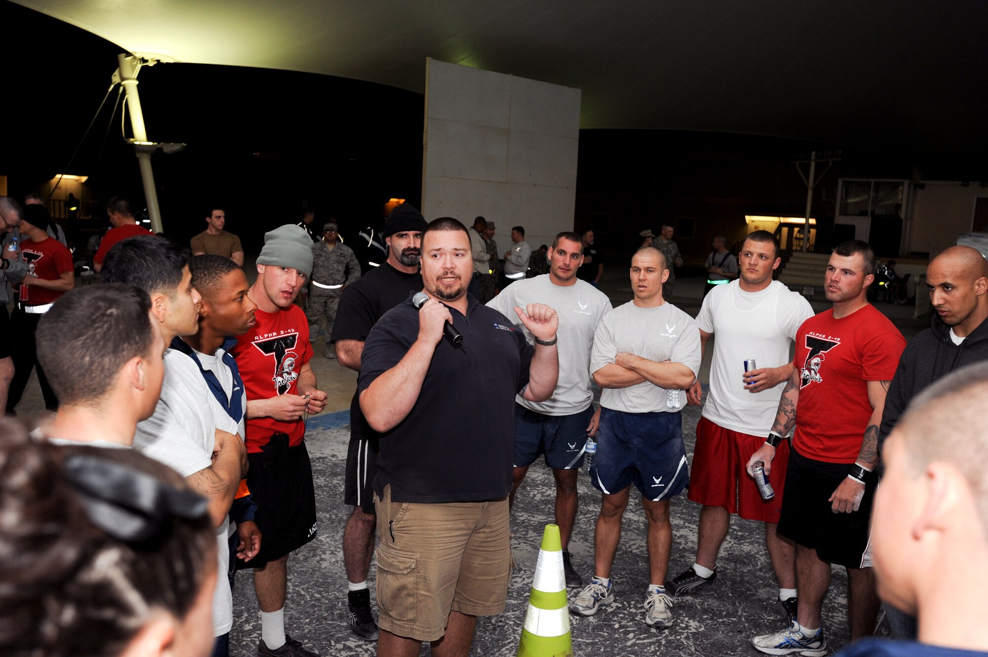 Travis Luethe, the assistant fitness manager for the 379th Expeditionary Force Support Squadron, briefs participants on safety precautions prior to an event during the Strongman Competition here, Feb. 28, 2009, in an undisclosed location in Southwest Asia.  The competition enabled entrants to compete against one another according to weight class to see who the strongest person in the region is.  Mr. Luethe is native to Seattle, Wash. and is stationed here as a civilian contractor in support of Operations Iraqi and Enduring Freedom and Combined Joint Task Force - Horn of Africa.  (U.S. Air Force Photo by Staff Sgt. Joshua Garcia/released)