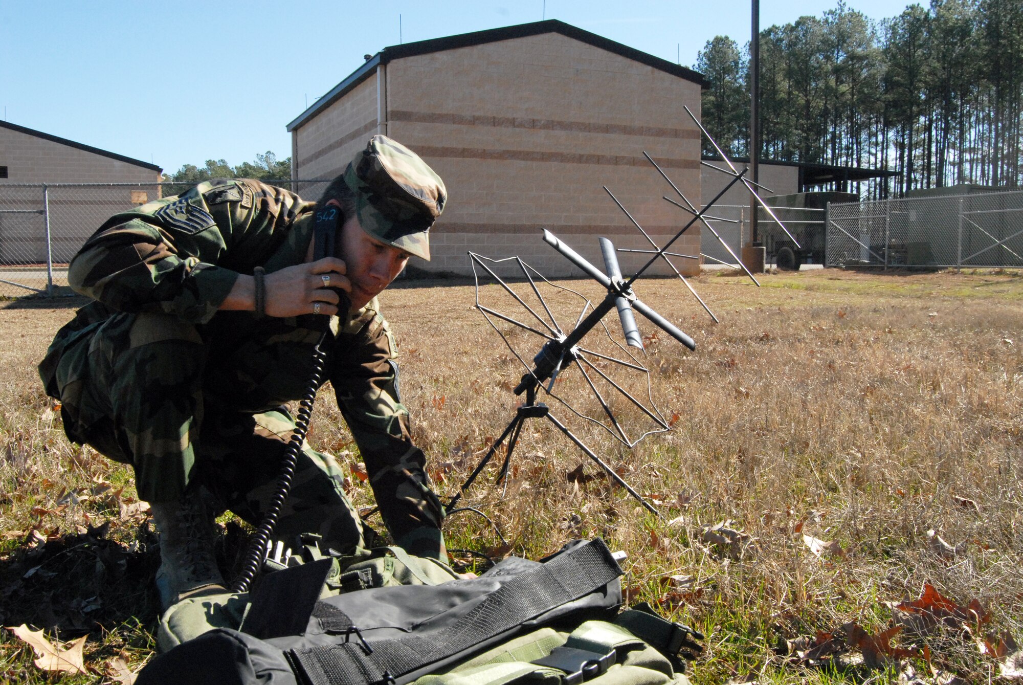 Tech. Sgt. Brion Rockel, 18th Weather Squadron, simulates overtaking an enemy airfield and setting up weather support by the Air Traffic Control tower. (U.S. Air Force Photo by Emily Farrington-Smith)