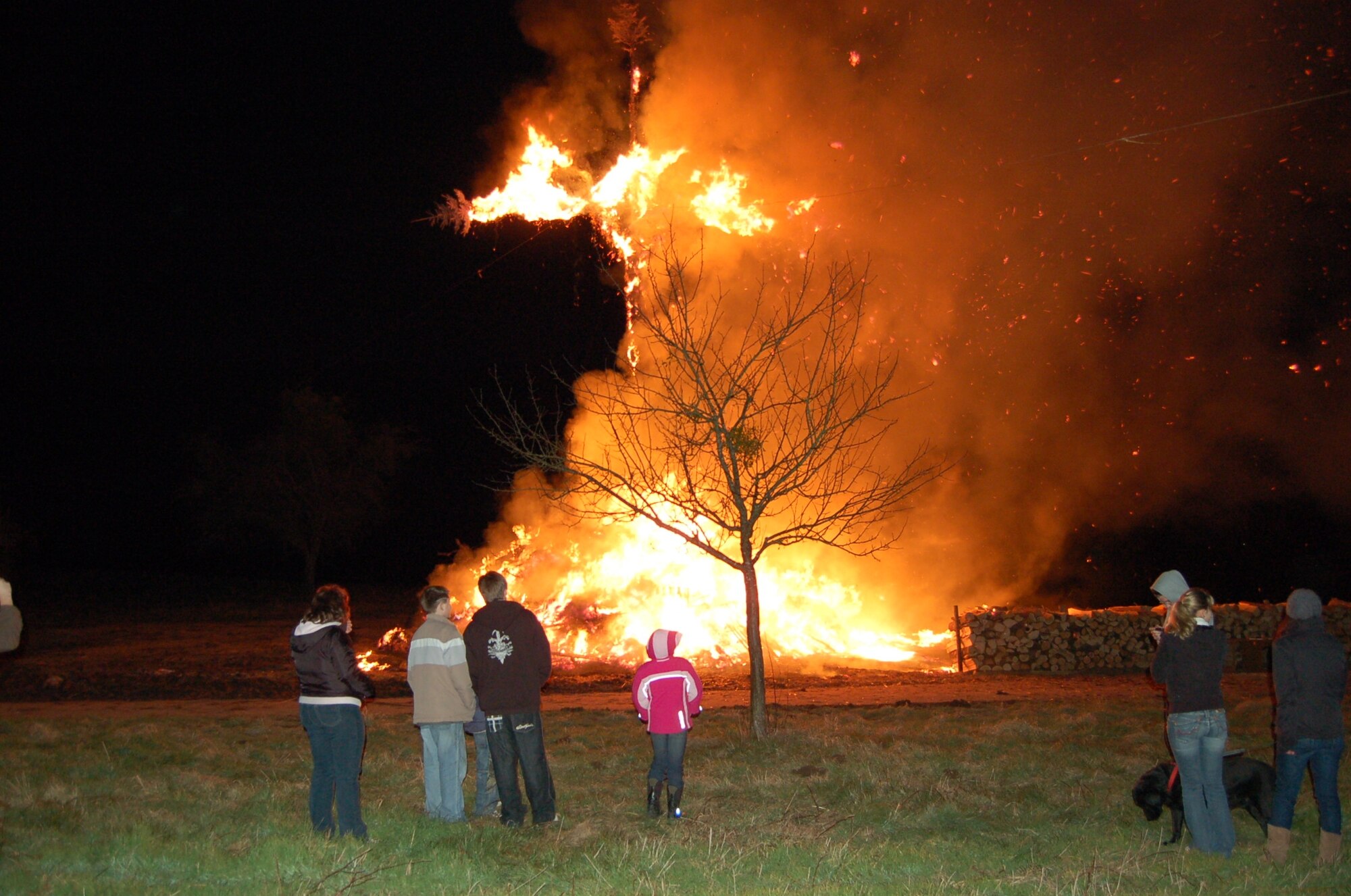 PREIST, Germany -- Local children watch the “Huetten” bonfire during the 2008 Lent festivities in the Eifel community of Preist.  This custom goes back to ancient tradition of chasing away winter spirits. After most of the fire has burnt, the youngsters go from house to house, sometimes reciting poems or sing a song. (U.S. Air Force photo by Iris Reiff)