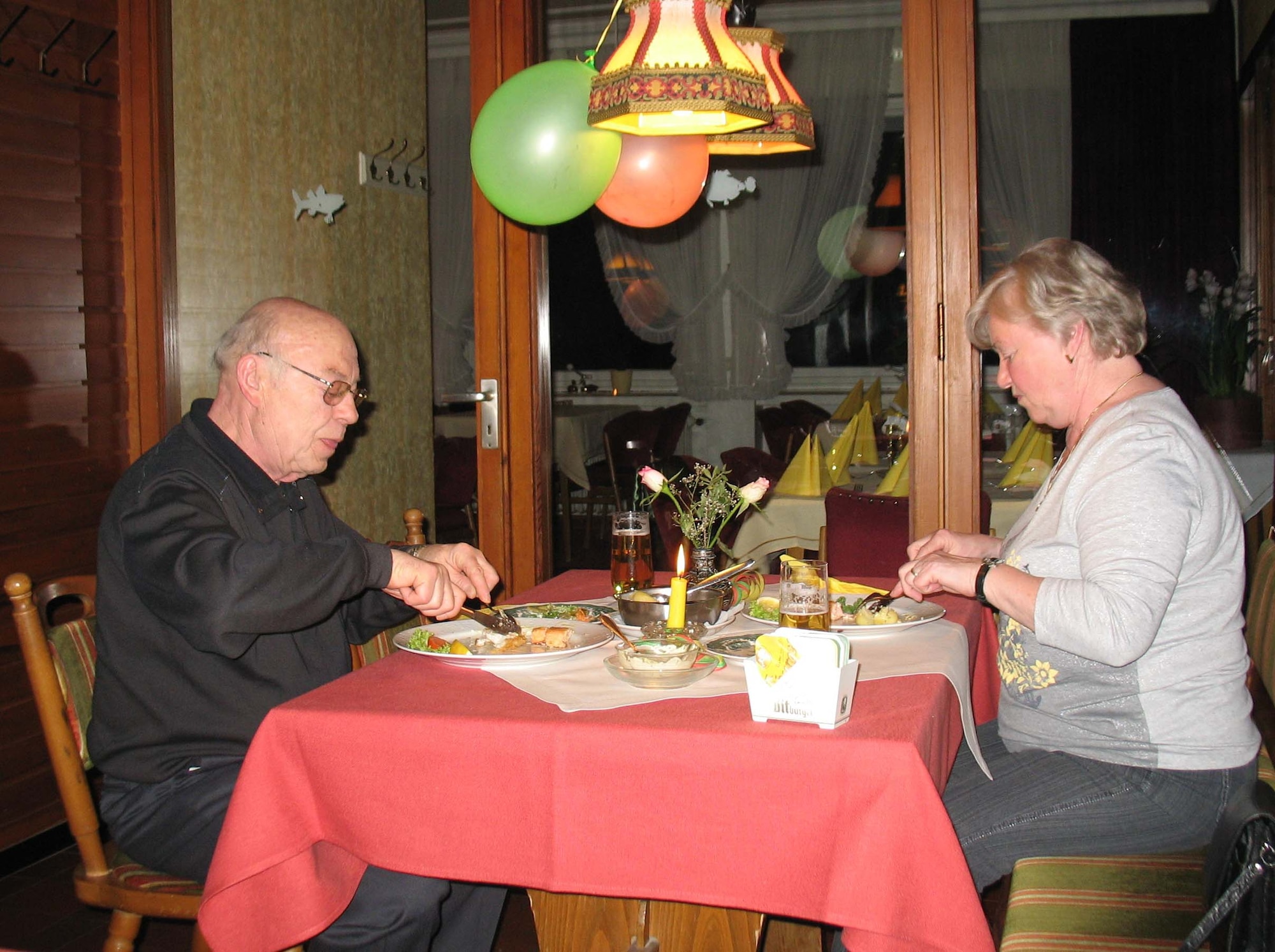 LANDSCHEID, Germany -- Ulla Kempka and husband Karl-Heinz enjoy a herring fish meal for Ash Wednesday at the “Lamberty” restaurant in Landscheid-Niederkail. The strict rules in the Middle Ages dictated nothing from a warm-blooded animal, with the exception of eggs, was allowed on the table during Lent.  (U.S. Air Force photo by Iris Reiff)
