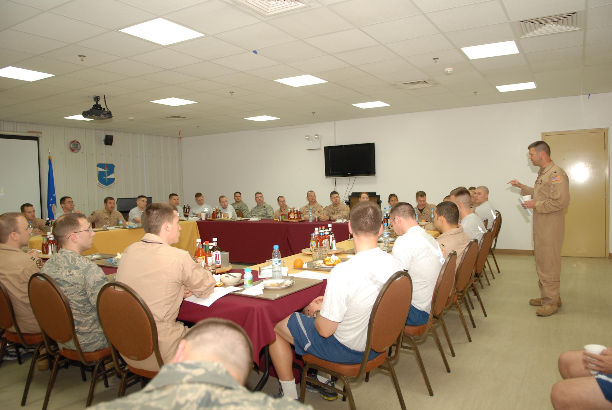 Lt. Col. Robert Haines, 963rd Expeditionary Airborne Air Control Squadron commander addresses a room full of CGOs on professional development. Colonel Haines is deployed from Tinker AFB, Okla. (U.S. Air Force photo by Captain Jennifer Pearson) (Released)