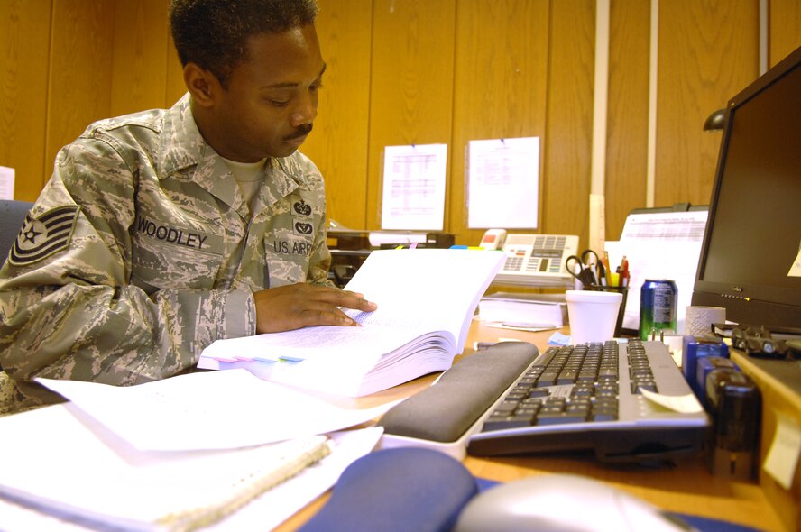 Tech. Sgt. Corey Woodley, an Air Force paralegal reservist instructor, reviews the Manual for Courts-Martial for information concerning a case. Sergeant Woodley, a reserve instructor at the Air Force Judge Advocate General’s School, is currently TDY to Ramstein assisting with UCI preparation. Paralegals often find themselves doing research for cases in military justice, claims, or other areas of law. (Air Force photo by Tech. Sgt. Michael Voss) 