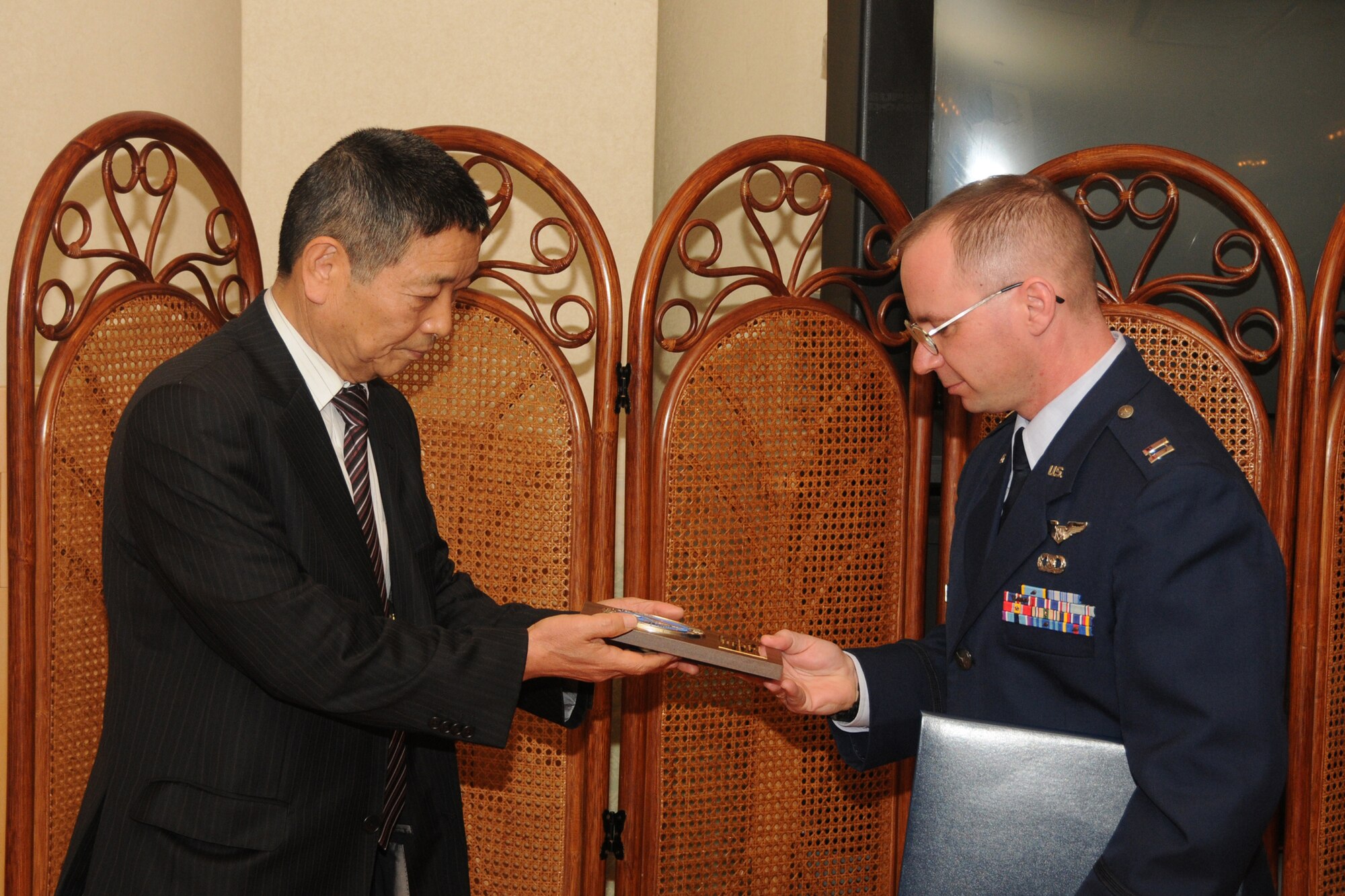 MISAWA AIR BASE, Japan -- Capt. Chad Pelletier, 610th Air Control Flight, receives a Japan-America Air Force Goodwill Association award from Japan Air Self-Defense Force retired Gen. Ikuo Tohtake Feb. 20, 2009. Captain Pelletier was recognized for his contributions to the annual Japan Day event as project officer for the 35th Operations Group. (U.S. Air Force photo by Senior Airman Jamal D. Sutter)