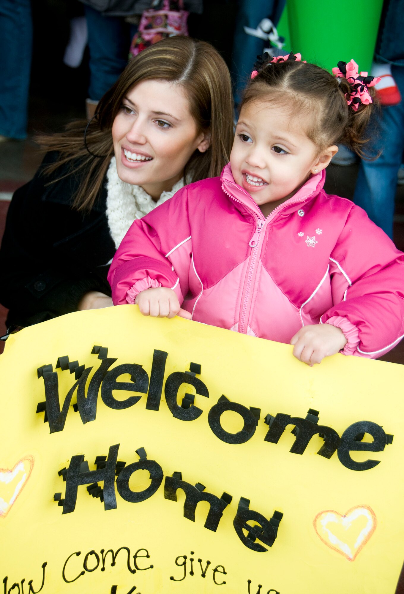 MISAWA AIR BASE, Japan -- Jill and Jada Banks await the arrival of Senior Airman Corey Banks March 1, 2009. Airman Banks was one of 275 Airmen to return to Misawa following a deployment to Joint Base Balad, Iraq. (U.S. Air Force photo by Staff Sgt. Rachel Martinez)