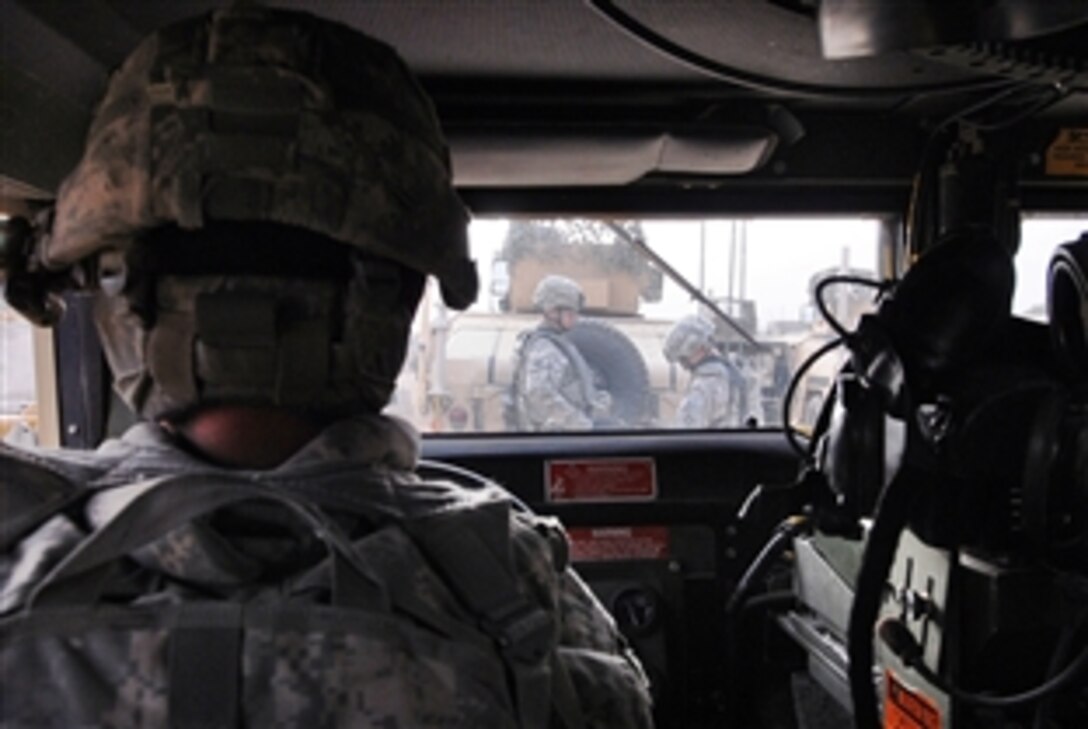 U.S. Army soldiers prepare to move out for a patrol on Joint Security Station 2, Iraq, Feb. 21, 2009. The soldiers are assigned to the 4th Infantry Division's 2nd Brigade Combat Team.
