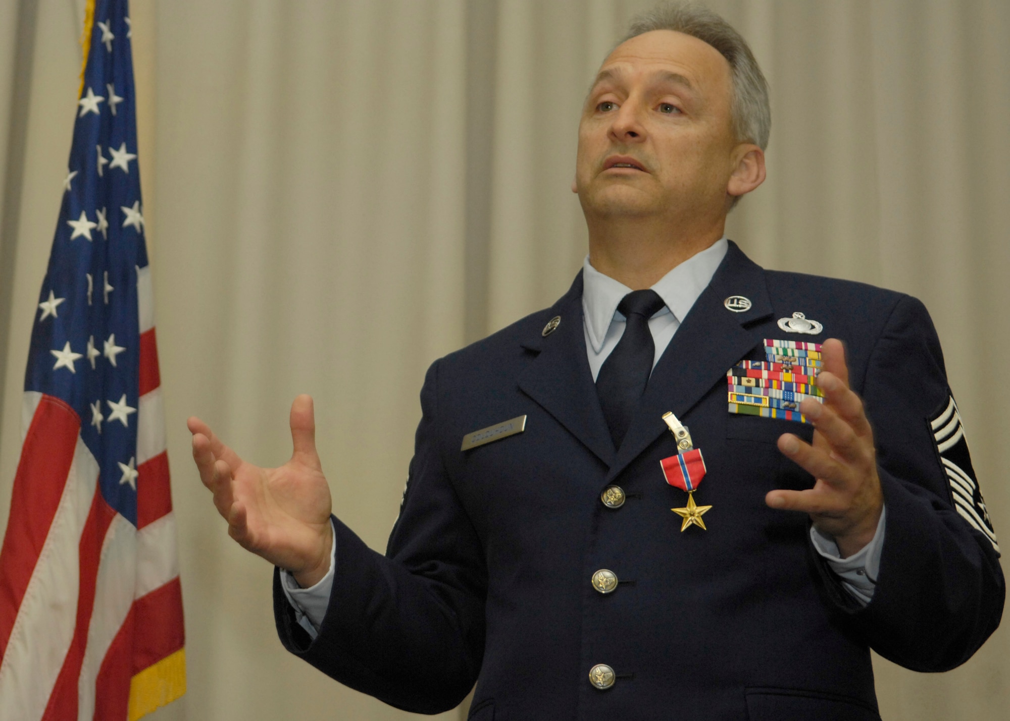 VANDENBERG AIR FORCE BASE, Calif. -- Retired Chief Master Sgt. Edward Colquhoun gives a speech after he received the Bronze Star Medal here March 3. The Bronze Star Medal is awarded for acts of bravery, merit and meritorious service.(U.S. Air Force photo/Airman 1st Class Andrew Lee) 
 