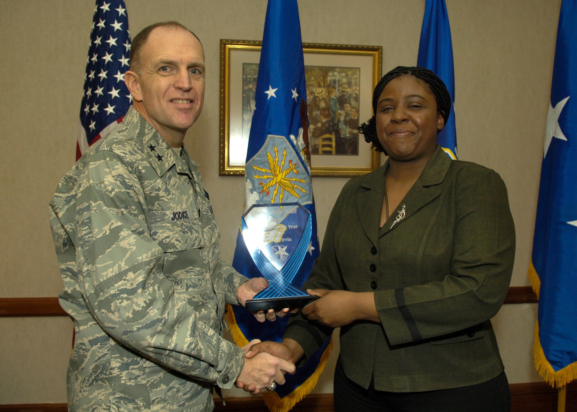Maj. Gen. Ralph Jodice, Air Force District of Washington commander, presents the 2008 AFDW Civilian of the Year (CAT III) to Ms. Vera Irvin, AFDW Contracting specialist. The award was presented Feb. 25 at The Club on Andrews Air Force Base, Md. 