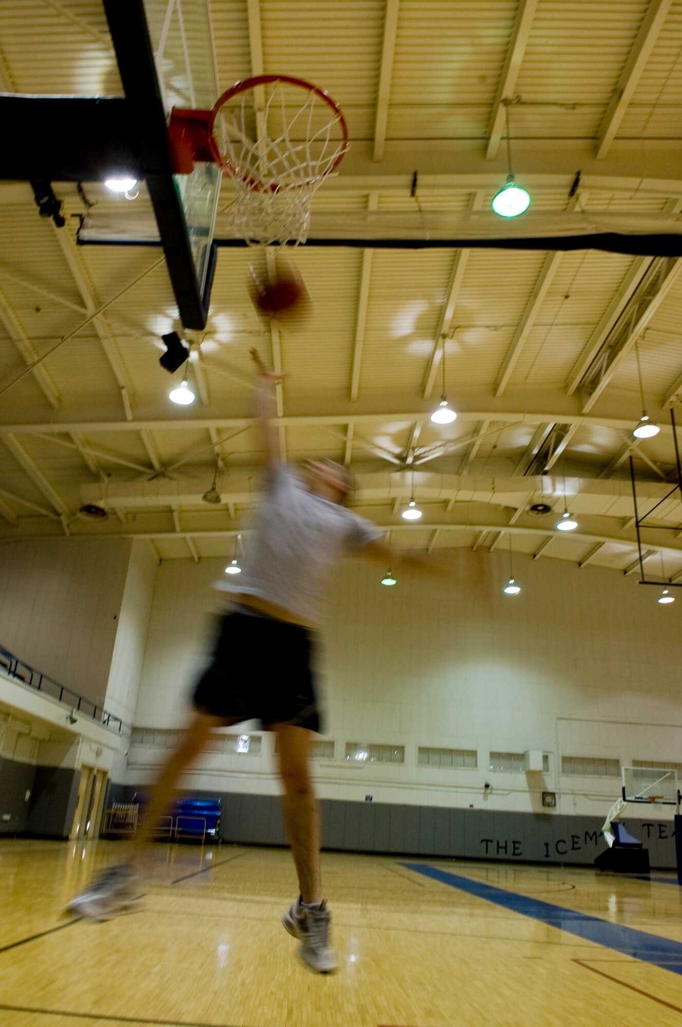 Senior Airman Tommy Lee, 354th Logistics Readiness Squadron fuels technician, goes for a layup while playing basketball March 3, 2009, Eielson Air Force Base, Alaska. With the transition of becoming a more fit force, Eielson Airmen keep in shape by taking advantage of the variety of fitness programs provided by the fitness center.  (U.S. Air Force Photo/Senior Airman Christopher Griffin)