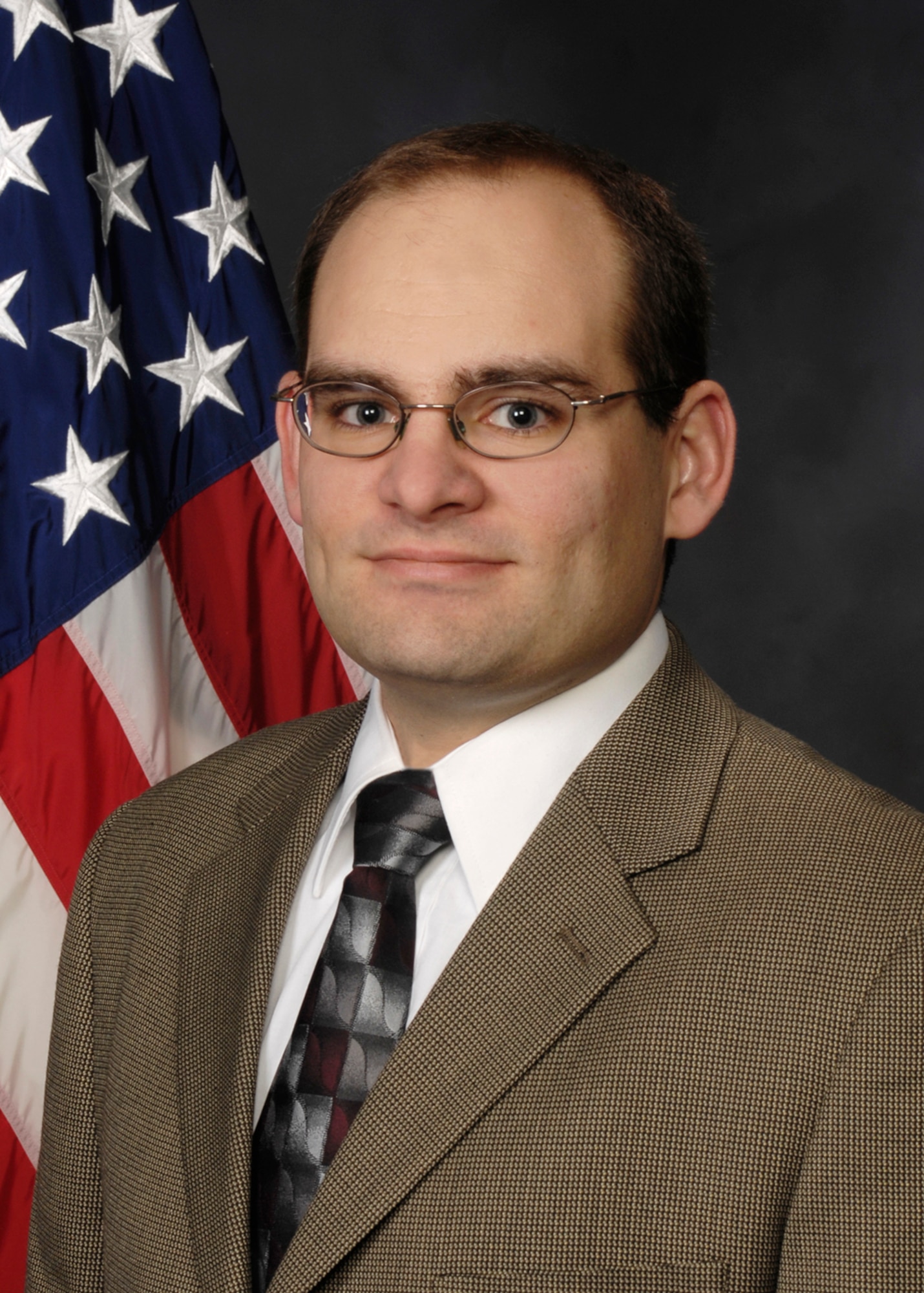 At the AFRL Air Vehicles Directorate 43rd Annual Awards Luncheon, Matthew Duquette was honored with Courtland D. Perkins award for his development of a simulation framework supporting cooperative control systems for unmanned aerial vehicles. (U.S. Air Force photo)