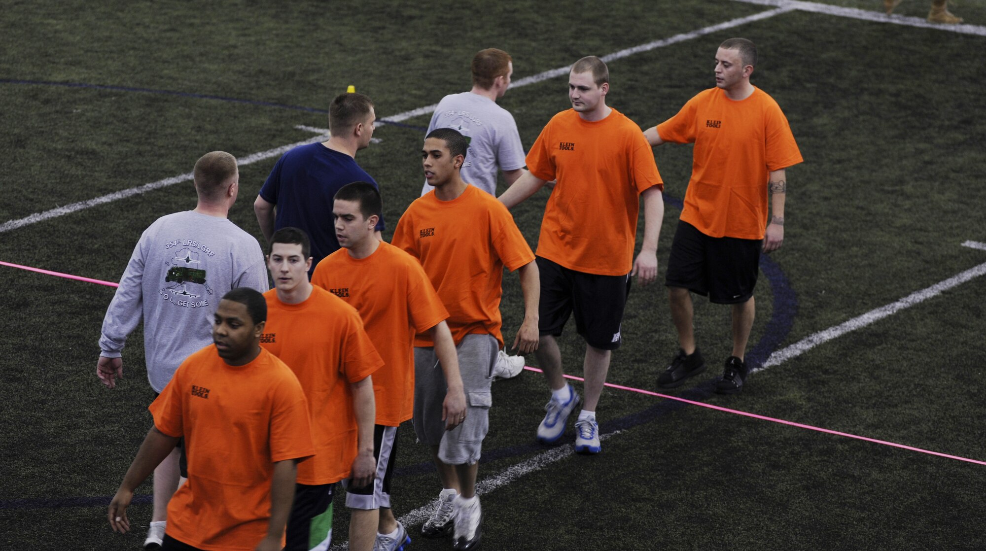 Airmen shake hands after a game of dodgeball Feb. 27, 2009 at Eielson Air Force Base, Alaska.  Team Hot sticks from the 354 Fighter Wing Electrical Systems Shop were the champions of the day defeating all their opponents.  Several Airmen from different shops around Eielson came out to the Baker Field House for customer appreciation day to play a game of dodgeball and enjoy refreshments in the gym. (U.S. Air Force photo/Airman 1st Class Laura Max)