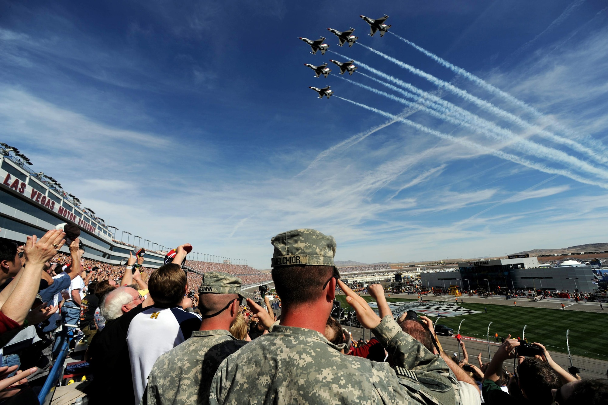 The U.S. Air Force Air Demonstration Squadron "Thunderbirds" fly over the Las Vegas Motor Speedway during the Shelby 427 NASCAR Sprint Cup race March 1 in Las Vegas. (U.S. Air Force photo/Staff Sgt Kristi Machado)