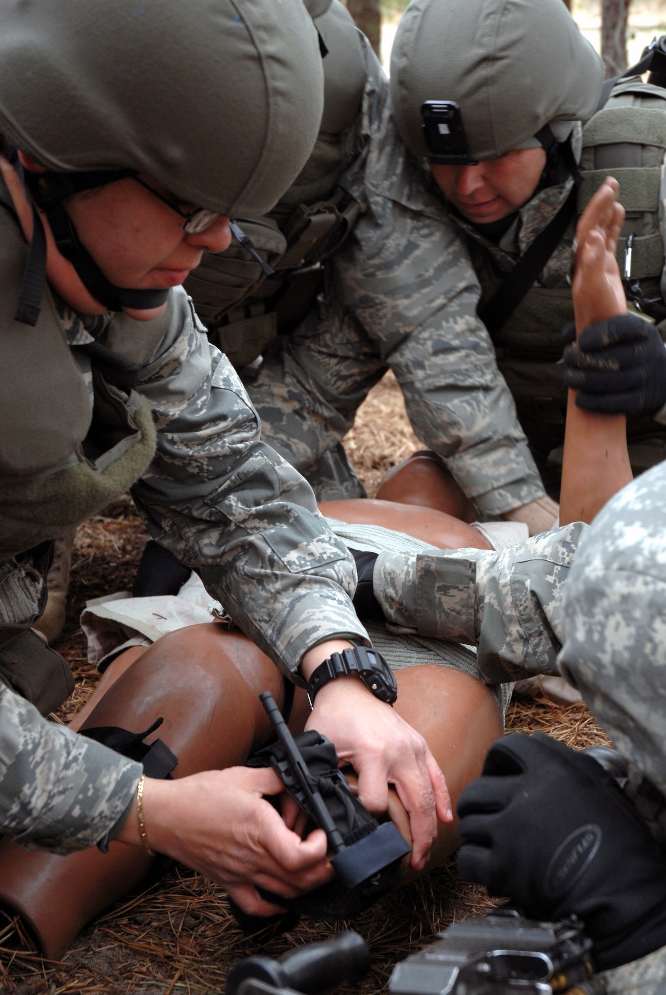 Students in the Air Force Phoenix Warrior Training Course practice combat first aid on a Fort Dix, N.J., range on Feb. 28, 2009.  The course, taught by the U.S. Air Force Expeditionary Center's 421st Combat Training Squadron at Fort Dix, N.J., prepares security forces Airmen for upcoming deployments.  (U.S. Air Force Photo/Staff Sgt. Paul R. Evans)