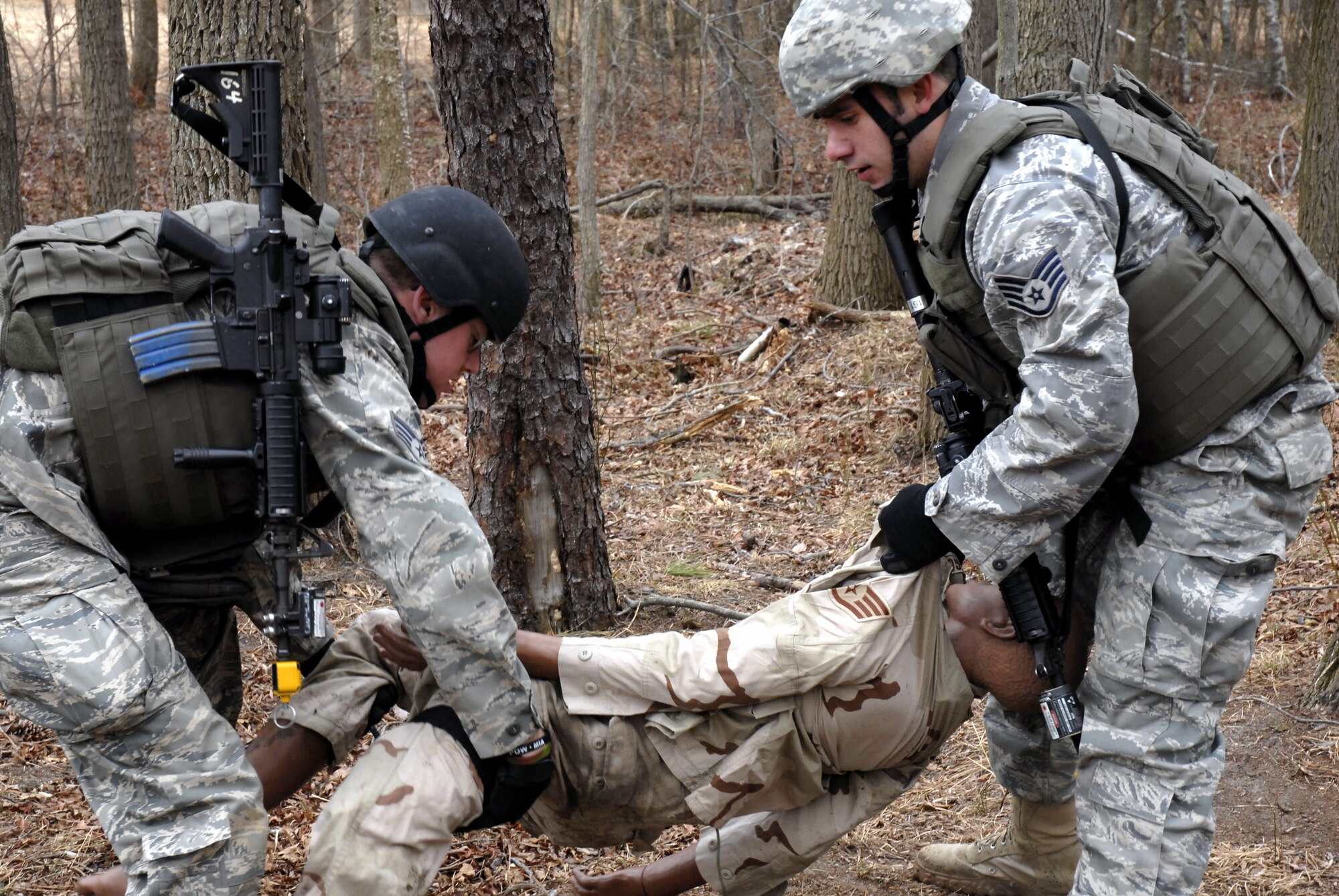 Students in the Air Force Phoenix Warrior Training Course practice combat first aid on a Fort Dix, N.J., range on Feb. 28, 2009.  The course, taught by the U.S. Air Force Expeditionary Center's 421st Combat Training Squadron at Fort Dix, N.J., prepares security forces Airmen for upcoming deployments.  (U.S. Air Force Photo/Staff Sgt. Paul R. Evans)
