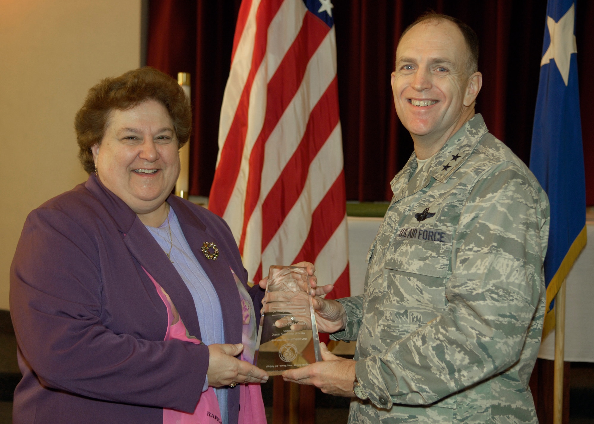 Maj. Gen. Ralph Jodice, Air Force District of Washington commander, presents the AFDW Oustanding Chaplain Corps Civilian Employee of the Year Award to Sister Mary Rita Smith. The award presentation took place Feb. 25, 2009, at the Andrews Air Force Base, Md., chapel.  (U.S Air Force photo by Senior Airman Renae Kleckner.)