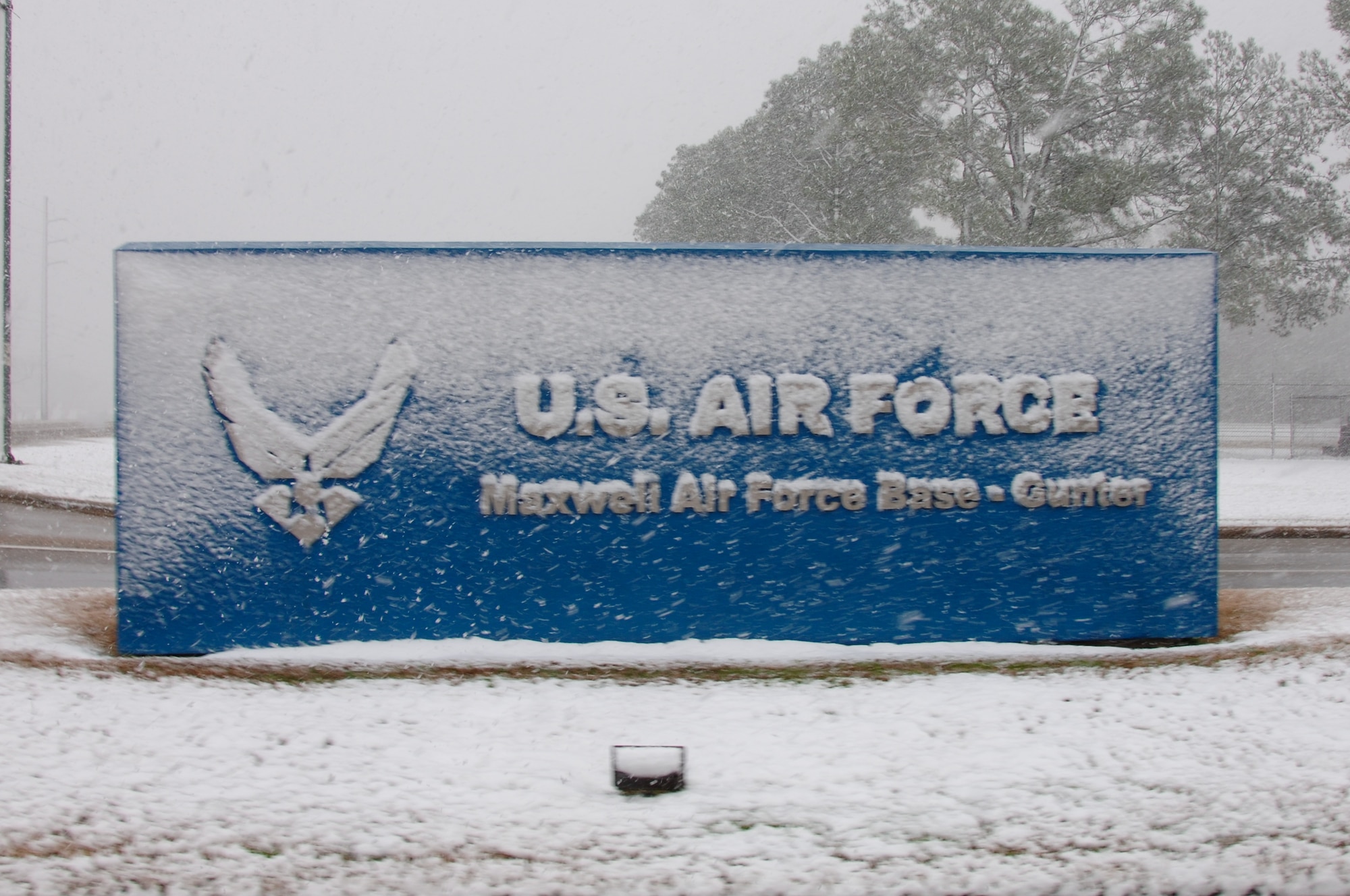 Snow covers a sign at Maxwell Air Force Base's Gunter Annex on Sunday. The snowfall accumulated nearly an inch on base as the storm moved through the Montgomery area. (Air Force photo by Donna Burnett)