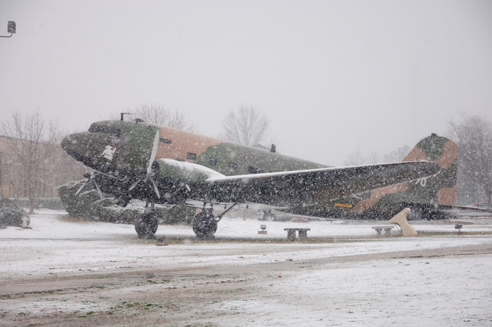 Snow falls on a Douglas AC-47 gunship nicknamed Spooky at Maxwell Air Force Base's Gunter Annex on Sunday. The morning snowfall blanketed the Montgomery, Ala. area as the snowstorm moved its way up the East Coast. (Air Force photo by Donna Burnett)