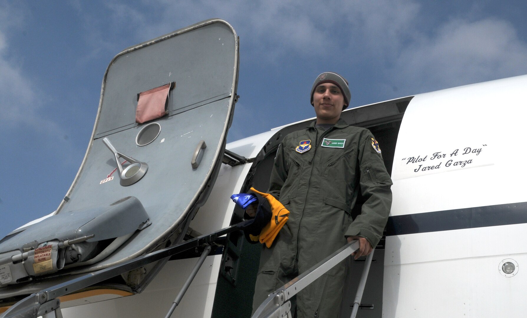 Jared Garza steps out of a T-1 during his adventure as Pilot for a Day on Feb. 27. (U.S. Air Force photo by Steve White)