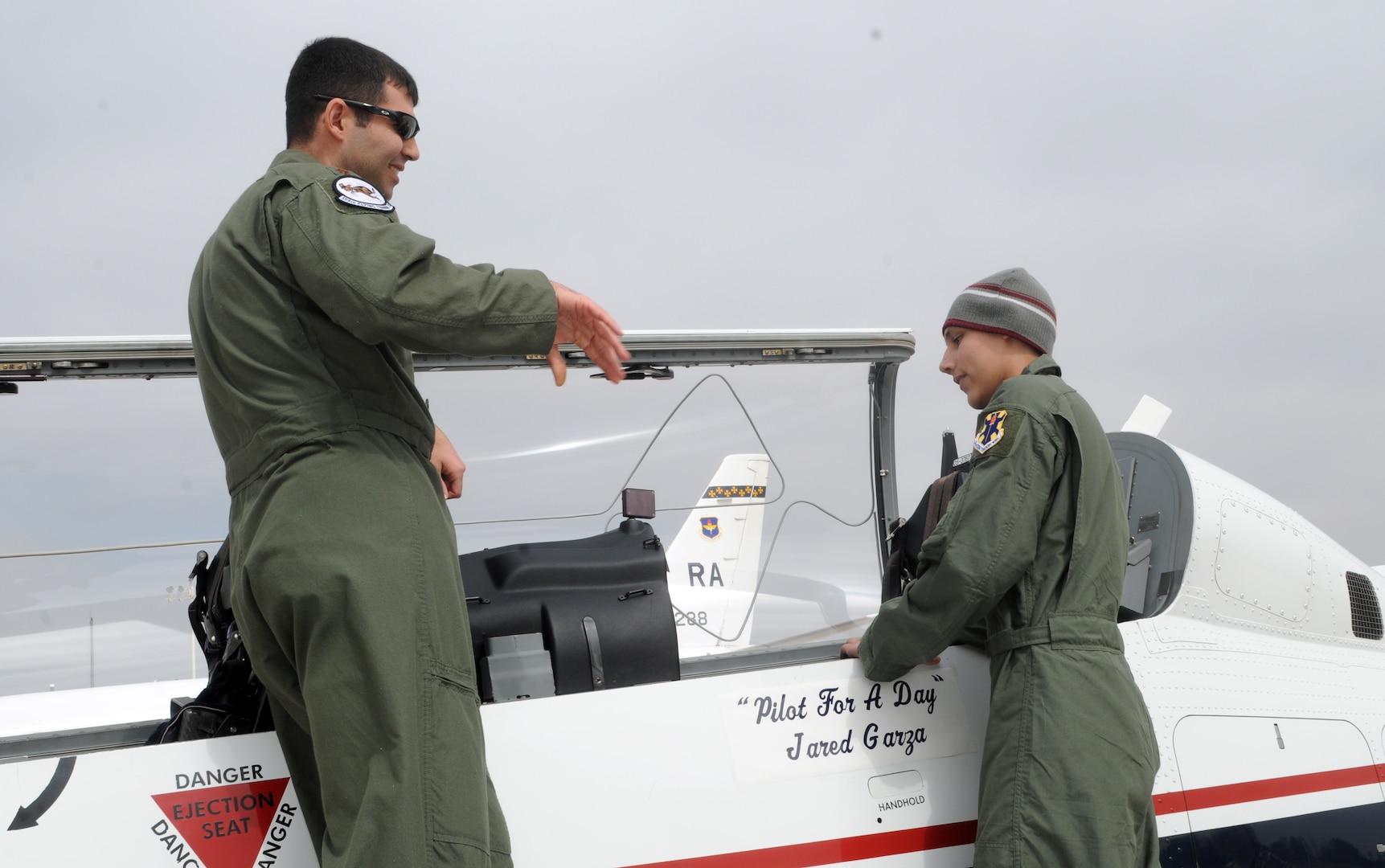 Capt. Bill Cook, 559th Flying Training Squadron executive officer, introduces Jared Garza to a T-6 during Pilot for a Day on Feb. 27. (U.S. Air Force photo by Steve White)