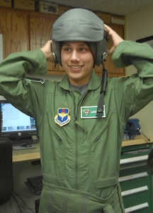 Pilot for a Day Jared Garza finds the helmet waiting for him is a perfect fit. (U.S. Air Force photo by Steve White)