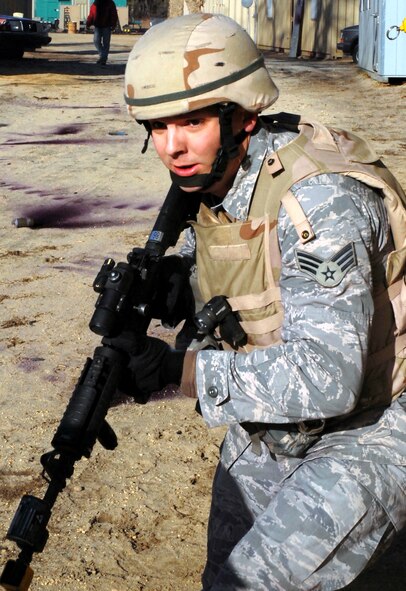 A student in the Air Force Phoenix Warrior Training Course practices tactics for military operations in urban terrain during training on Naval Air Engineering Station Lakehurst, N.J., on Feb. 23, 2009.  The course, taught by the U.S. Air Force Expeditionary Center's 421st Combat Training Squadron at Fort Dix, N.J., prepares security forces Airmen for upcoming deployments.  (U.S. Air Force Photo/Staff Sgt. Paul R. Evans)