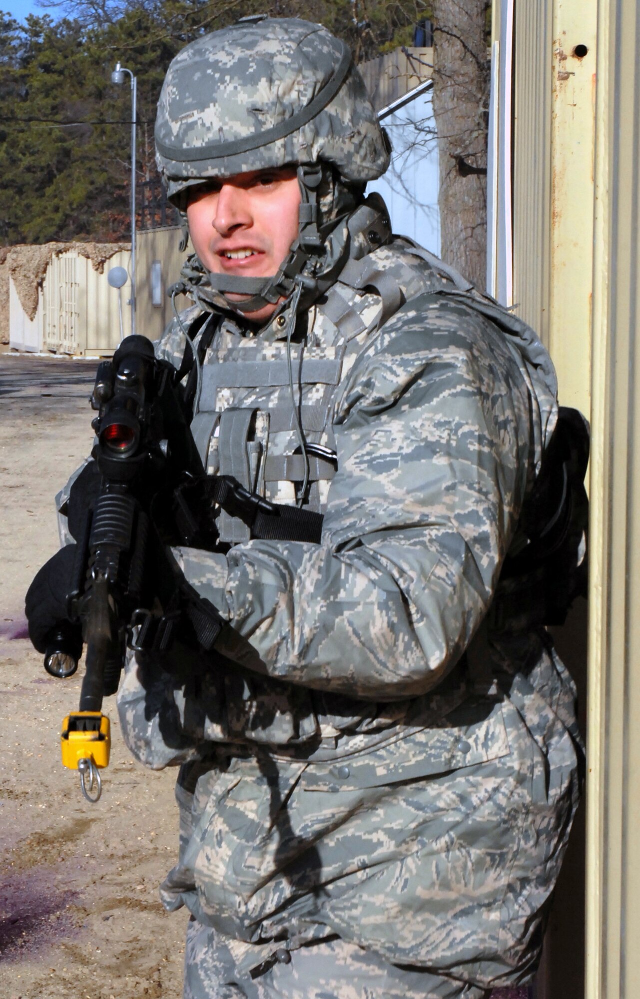 A student in the Air Force Phoenix Warrior Training Course practice tactics for military operations in urban terrain during training on Naval Air Engineering Station Lakehurst, N.J., on Feb. 23, 2009.  The course, taught by the U.S. Air Force Expeditionary Center's 421st Combat Training Squadron at Fort Dix, N.J., prepares security forces Airmen for upcoming deployments.  (U.S. Air Force Photo/Staff Sgt. Paul R. Evans)