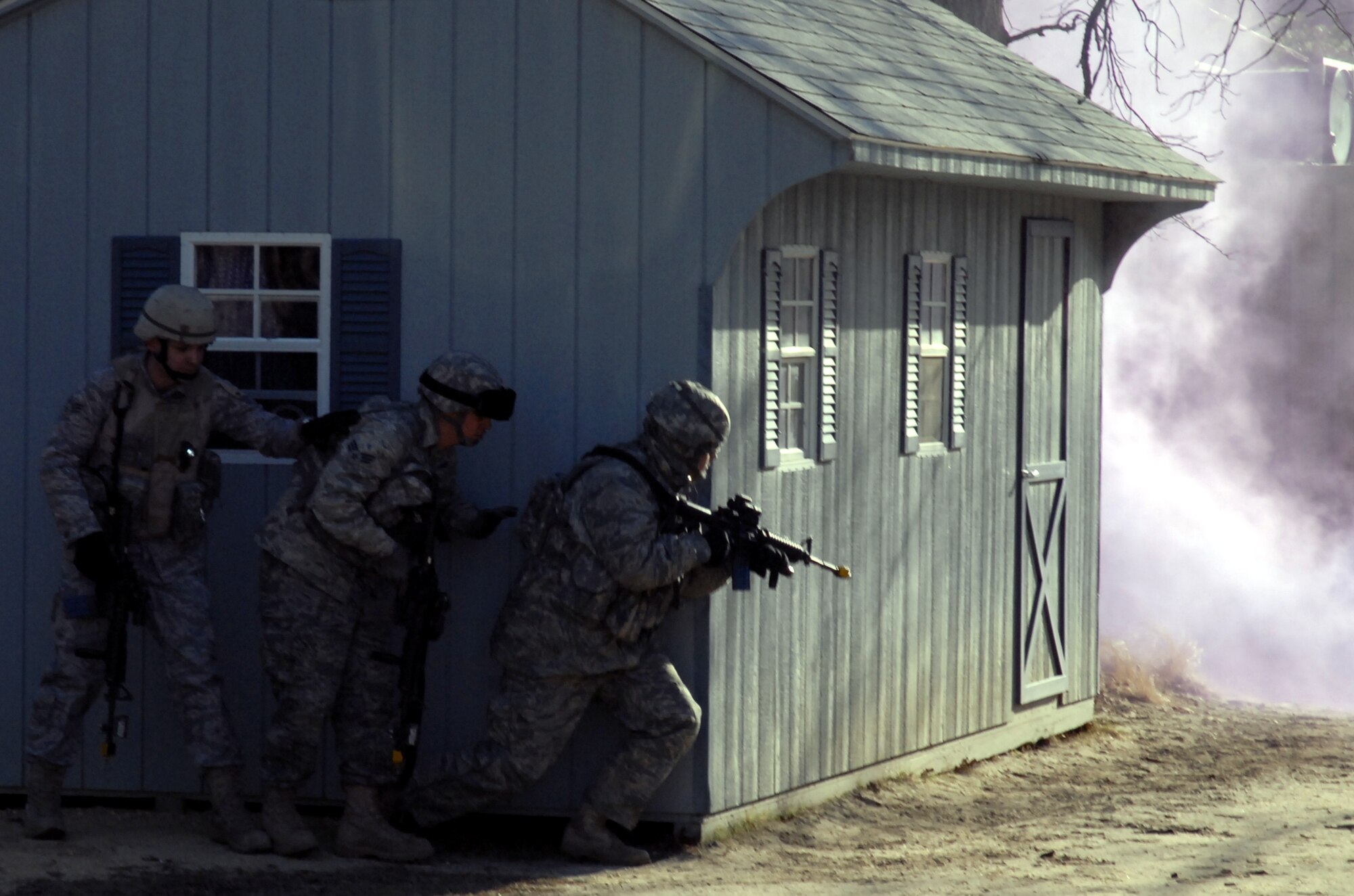 Students in the Air Force Phoenix Warrior Training Course practice tactics for military operations in urban terrain during training on Naval Air Engineering Station Lakehurst, N.J., on Feb. 23, 2009.  The course, taught by the U.S. Air Force Expeditionary Center's 421st Combat Training Squadron at Fort Dix, N.J., prepares security forces Airmen for upcoming deployments.  (U.S. Air Force Photo/Staff Sgt. Paul R. Evans)