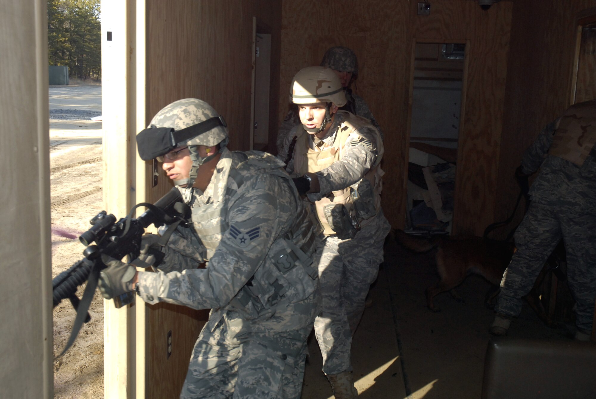 Students in the Air Force Phoenix Warrior Training Course practice tactics for military operations in urban terrain during training on Naval Air Engineering Station Lakehurst, N.J., on Feb. 23, 2009.  The course, taught by the U.S. Air Force Expeditionary Center's 421st Combat Training Squadron at Fort Dix, N.J., prepares security forces Airmen for upcoming deployments.  (U.S. Air Force Photo/Staff Sgt. Paul R. Evans)