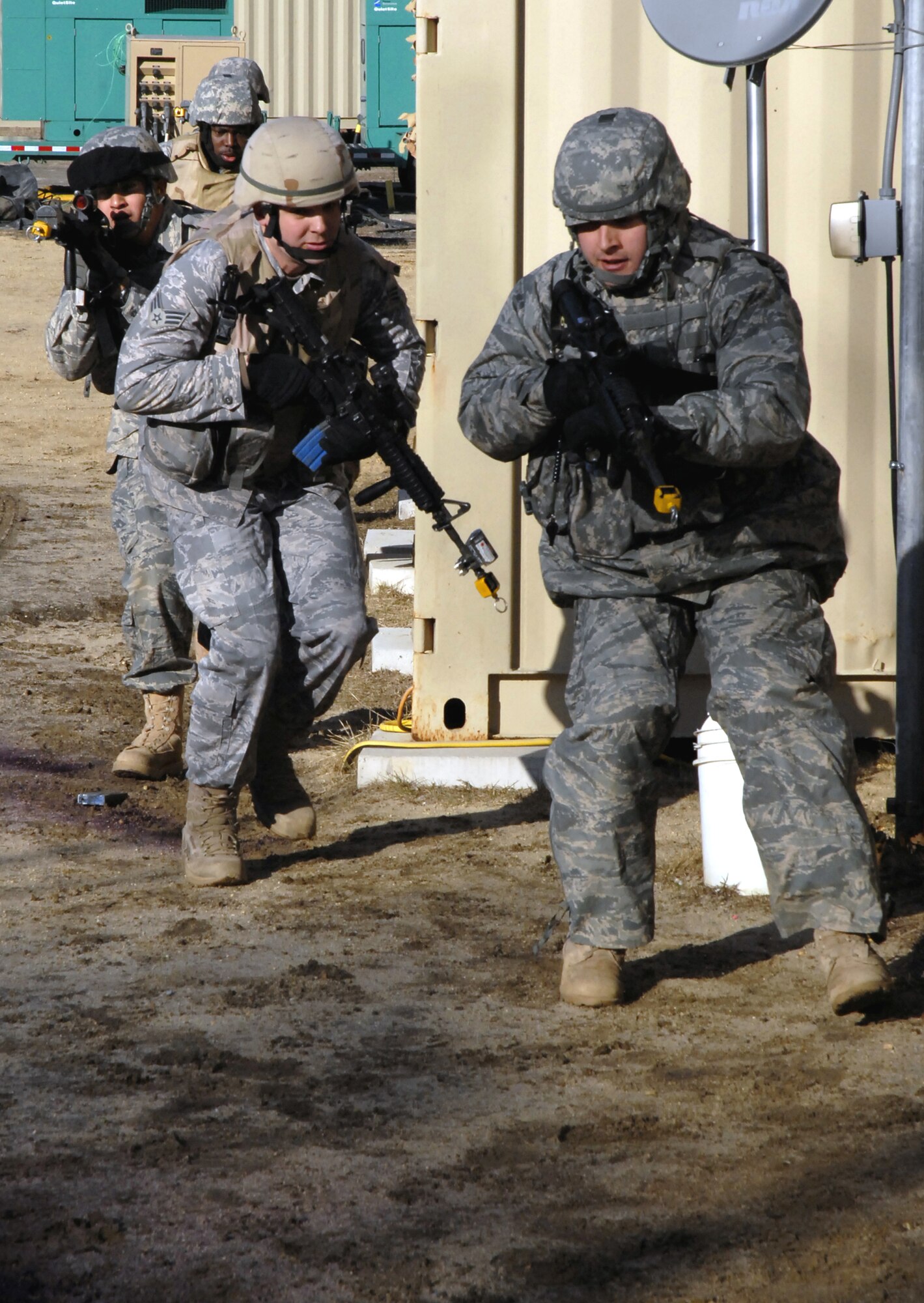 Students in the Air Force Phoenix Warrior Training Course practice tactics for military operations in urban terrain during training on Naval Air Engineering Station Lakehurst, N.J., on Feb. 23, 2009.  The course, taught by the U.S. Air Force Expeditionary Center's 421st Combat Training Squadron at Fort Dix, N.J., prepares security forces Airmen for upcoming deployments.  (U.S. Air Force Photo/Staff Sgt. Paul R. Evans)