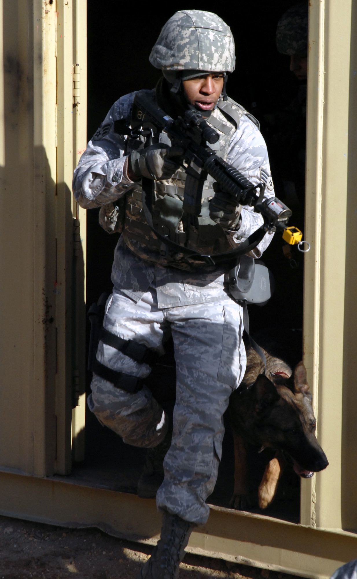 Students in the Air Force Phoenix Warrior Training Course practice tactics for military operations in urban terrain during training on Naval Air Engineering Station Lakehurst, N.J., on Feb. 23, 2009.  The course, taught by the U.S. Air Force Expeditionary Center's 421st Combat Training Squadron at Fort Dix, N.J., prepares security forces Airmen for upcoming deployments.  (U.S. Air Force Photo/Staff Sgt. Paul R. Evans)
