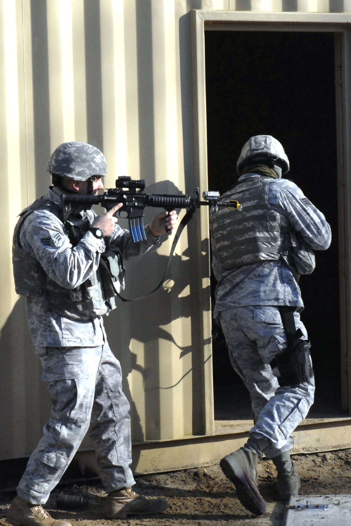 Students in the Air Force Phoenix Warrior Training Course practice tactics for military operations in urban terrain during training on Naval Air Engineering Station Lakehurst, N.J., on Feb. 23, 2009.  The course, taught by the U.S. Air Force Expeditionary Center's 421st Combat Training Squadron at Fort Dix, N.J., prepares security forces Airmen for upcoming deployments.  (U.S. Air Force Photo/Staff Sgt. Paul R. Evans)