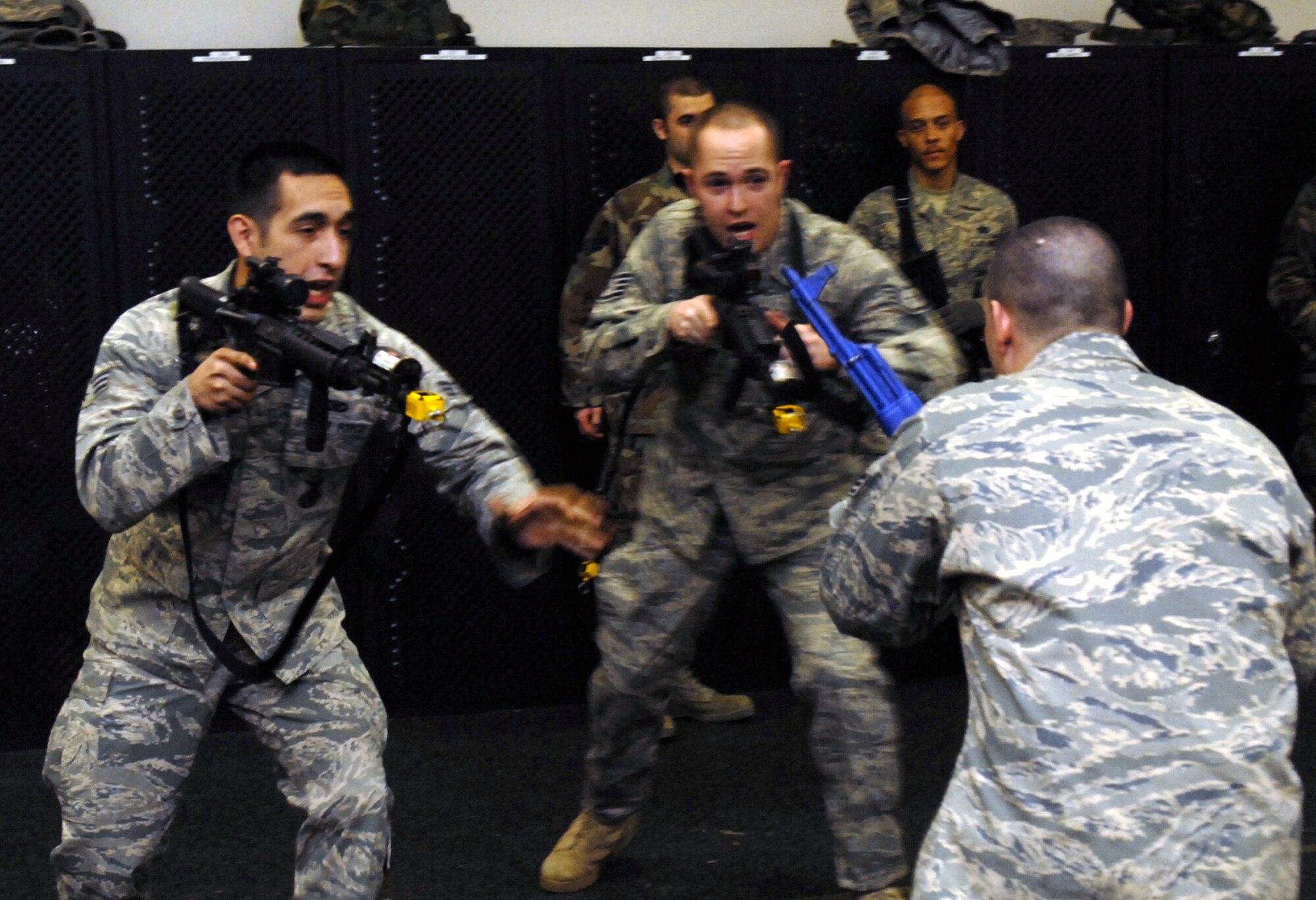 Students in the Air Force Phoenix Warrior Training Course practice tactics for military operations in urban terrain during "tape drills" inside a training room in the U.S. Air Force Expeditionary Center on Fort Dix, N.J., on Feb. 23, 2009.  The course, taught by the center's 421st Combat Training Squadron, prepares security forces Airmen for upcoming deployments.  (U.S. Air Force Photo/Staff Sgt. Paul R. Evans)
