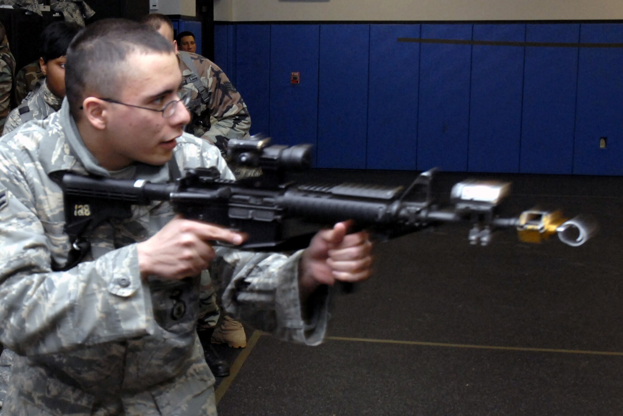 Students in the Air Force Phoenix Warrior Training Course practice tactics for military operations in urban terrain during "tape drills" inside a training room in the U.S. Air Force Expeditionary Center on Fort Dix, N.J., on Feb. 23, 2009.  The course, taught by the center's 421st Combat Training Squadron, prepares security forces Airmen for upcoming deployments.  (U.S. Air Force Photo/Staff Sgt. Paul R. Evans)