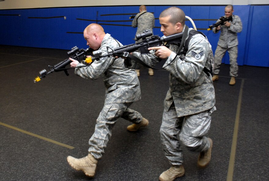 Students in the Air Force Phoenix Warrior Training Course practice tactics for military operations in urban terrain during "tape drills" inside a training room in the U.S. Air Force Expeditionary Center on Fort Dix, N.J., on Feb. 23, 2009.  The course, taught by the center's 421st Combat Training Squadron, prepares security forces Airmen for upcoming deployments.  (U.S. Air Force Photo/Staff Sgt. Paul R. Evans)