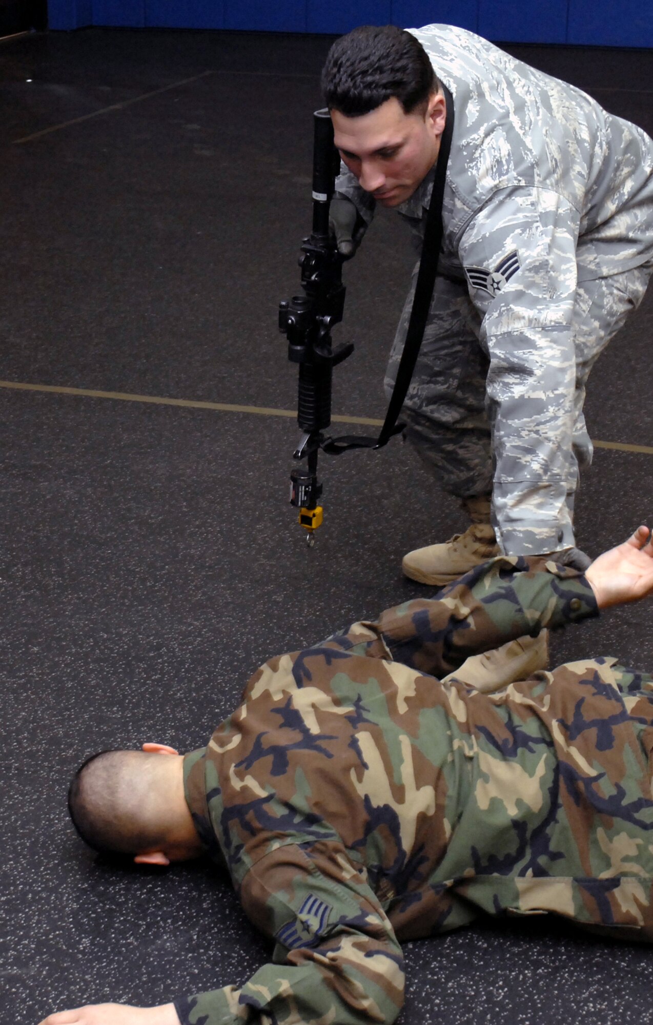 Students in the Air Force Phoenix Warrior Training Course practice tactics for military operations in urban terrain during "tape drills" inside a training room in the U.S. Air Force Expeditionary Center on Fort Dix, N.J., on Feb. 23, 2009.  The course, taught by the center's 421st Combat Training Squadron, prepares security forces Airmen for upcoming deployments.  (U.S. Air Force Photo/Staff Sgt. Paul R. Evans)