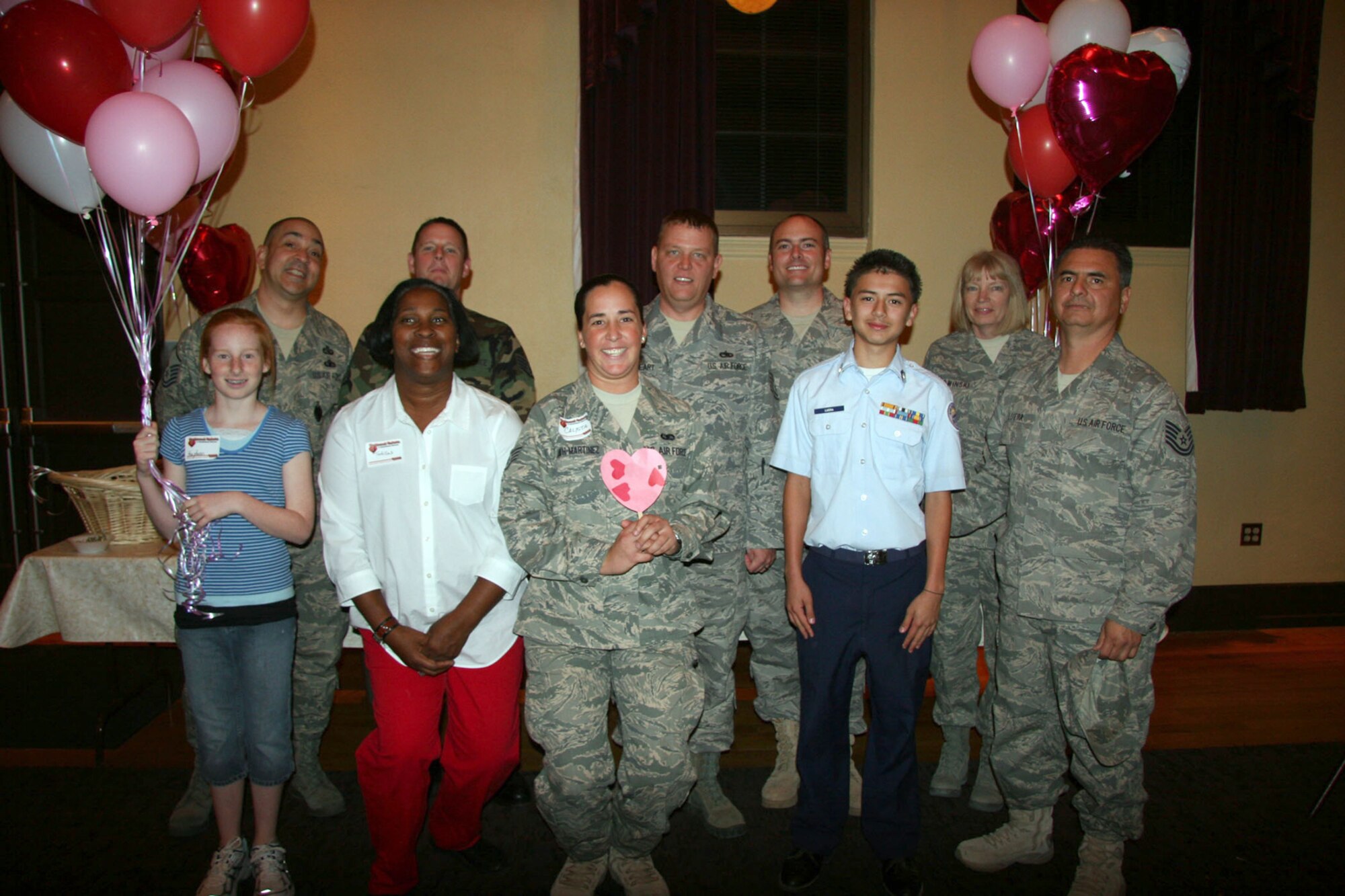 TUCSON, Ariz. -- Twelve Air Force Reservists representing the 943rd Rescue Group, 943rd Maintenance Squadron and 306th Rescue Squadron from Davis-Monthan AFB, Ariz. visited with hospitalized veterans Feb. 11, 2009 at the Southern Arizona VA Health Care System, Tucson, Ariz. during the National Salute to Hospitalized Veteran Celebration.  These Reservists and family members gave the veterans valentines, made by local school children, and blankets, made by VA volunteers, to hospitalized veterans.  During their visit they shared "war stories' from the past and present" giving the precious gift of time. The National Salute to Hospitalized Veterans is a celebration conducted around Valentines Day every year to pay tribute and express appreciation to hospitalized veterans.  This event is also intended to increase community awareness of the role of the medical center and encourage individuals to visit hospitalized veterans and become involved as volunteers. From top row,left: Master Sgt. Dominic Esparza, 943rd Mission Support Flight, Tech. Sgt. Brad Hovey, 943rd MSF, Tech. Sgt. Lacy Gearheart, 306th RQS, Staff Sgt. Tim Parrish, 943rd MXS and Tech. Sgt. Beth Barwinski. 943rd RQG Front row, left: Miss Kayden Hovey, Ms. Tortillas Bailey, 943rd MXS, Staff Sgt. Calista Heath-Martinez, 306th RQS, Master Sgt. Estevan Luera Desert View High School Jr. ROTC Cadet, and Tech. Sgt. Augustin Luera, 943rd MXS. (U.S. Air Force photo/Master Sgt. Ruby Zarzyczny