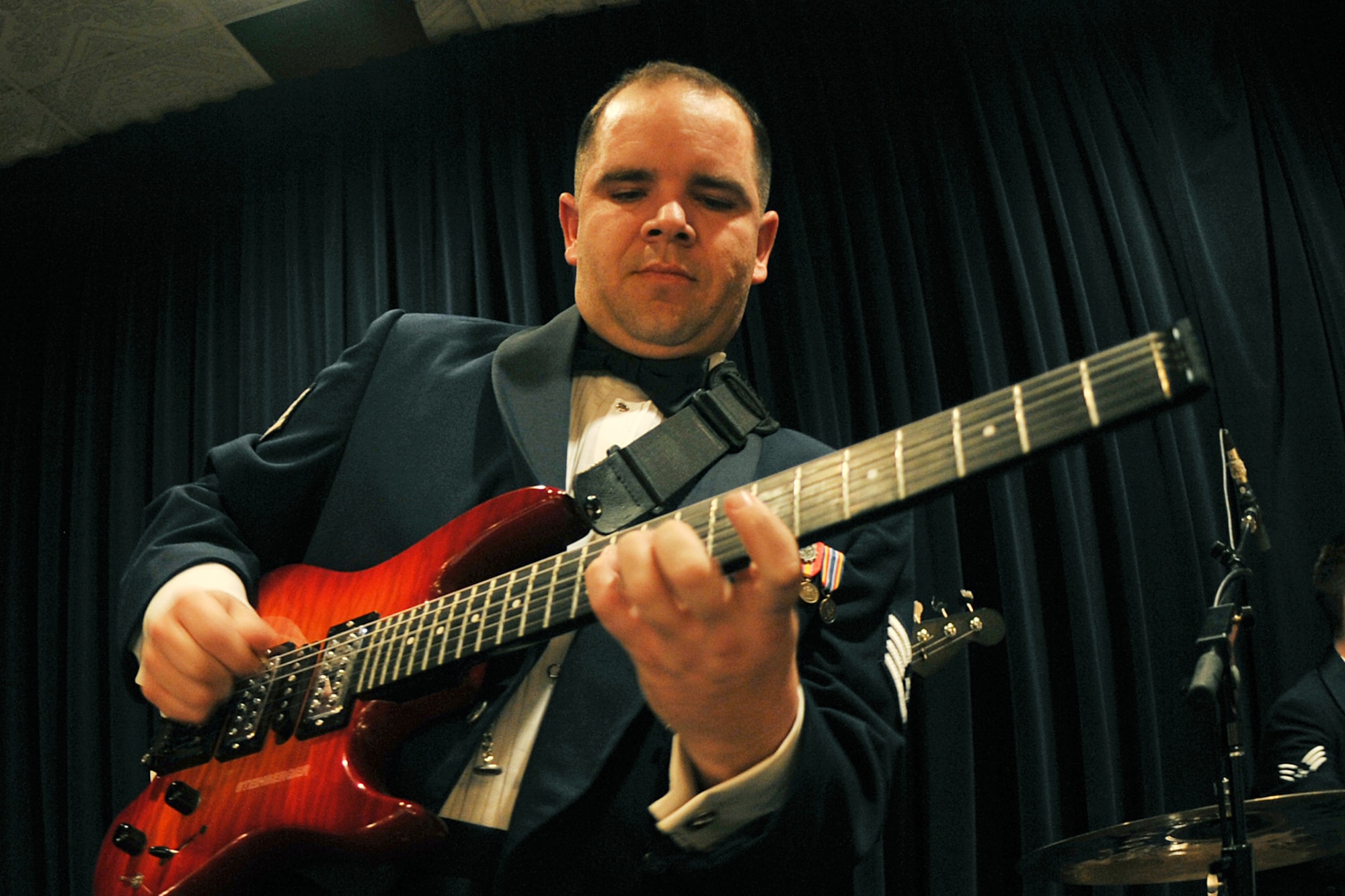 OFFUTT AIR FORCE BASE, Neb., -- Senior Airman Joshua Keen, Heartland of America Band, entertains the crowd during the 55th Wing Annual Awards Banquet held at the Patriot Club Feb. 27. Members of the 55th Wing came together to honor those who have demonstrated tireless dedication, faithful service and excelled in the past year representing the best of the best according to the general.

U.S. Air Force Photo By Charles Haymond