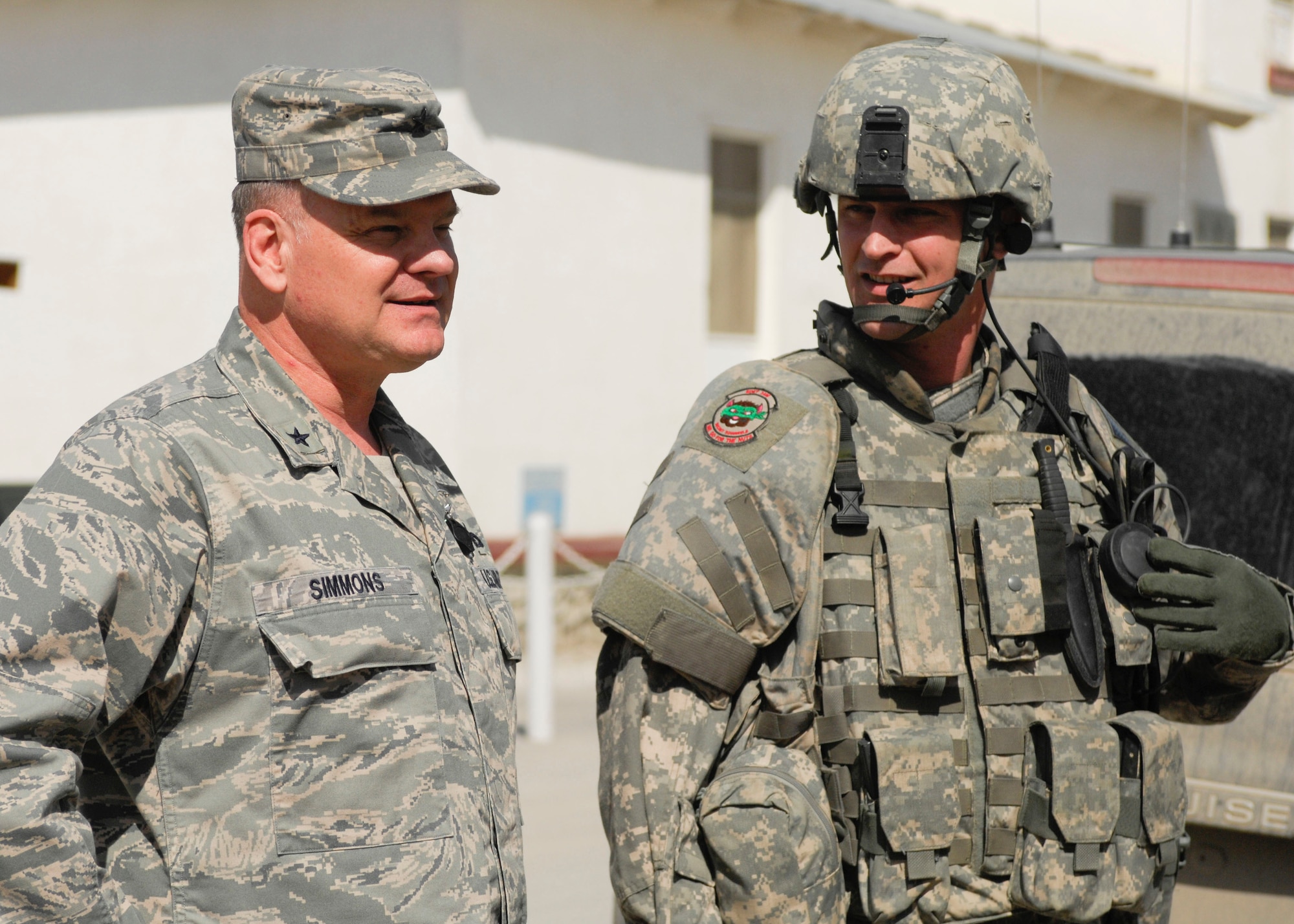 Brig. Gen. Dana Simmons, Air Force Office of Special Operations Investigations commander, speaks to Tech. Sgt. Brett Brockway, Expeditionary Detachment 2405, at Bagram Air Field, Afghanistan, recently. The General visited BAF to speak with Airmen and Department of Defense civilians contributing to the mission in Afghanistan. (U.S. Air Force photo/Senior Airman Erik Cardenas)